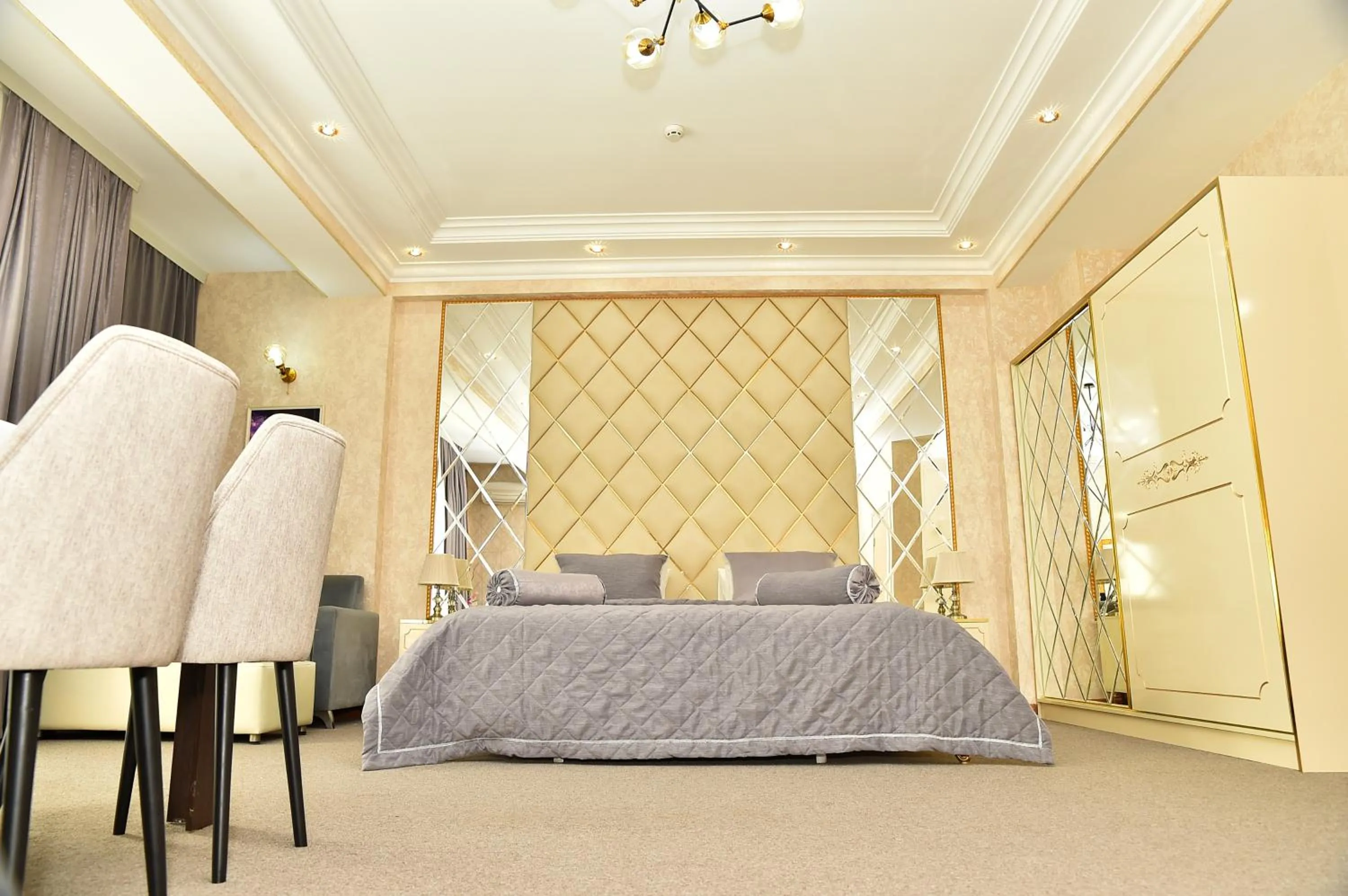 Bed in Karat Inn Boutique Hotel