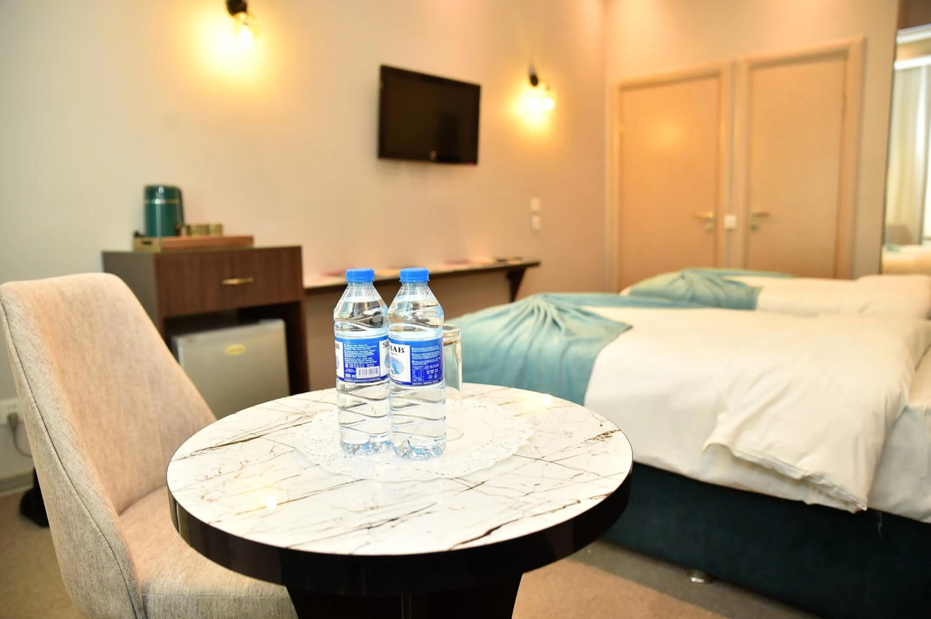 Bed in Karat Inn Boutique Hotel