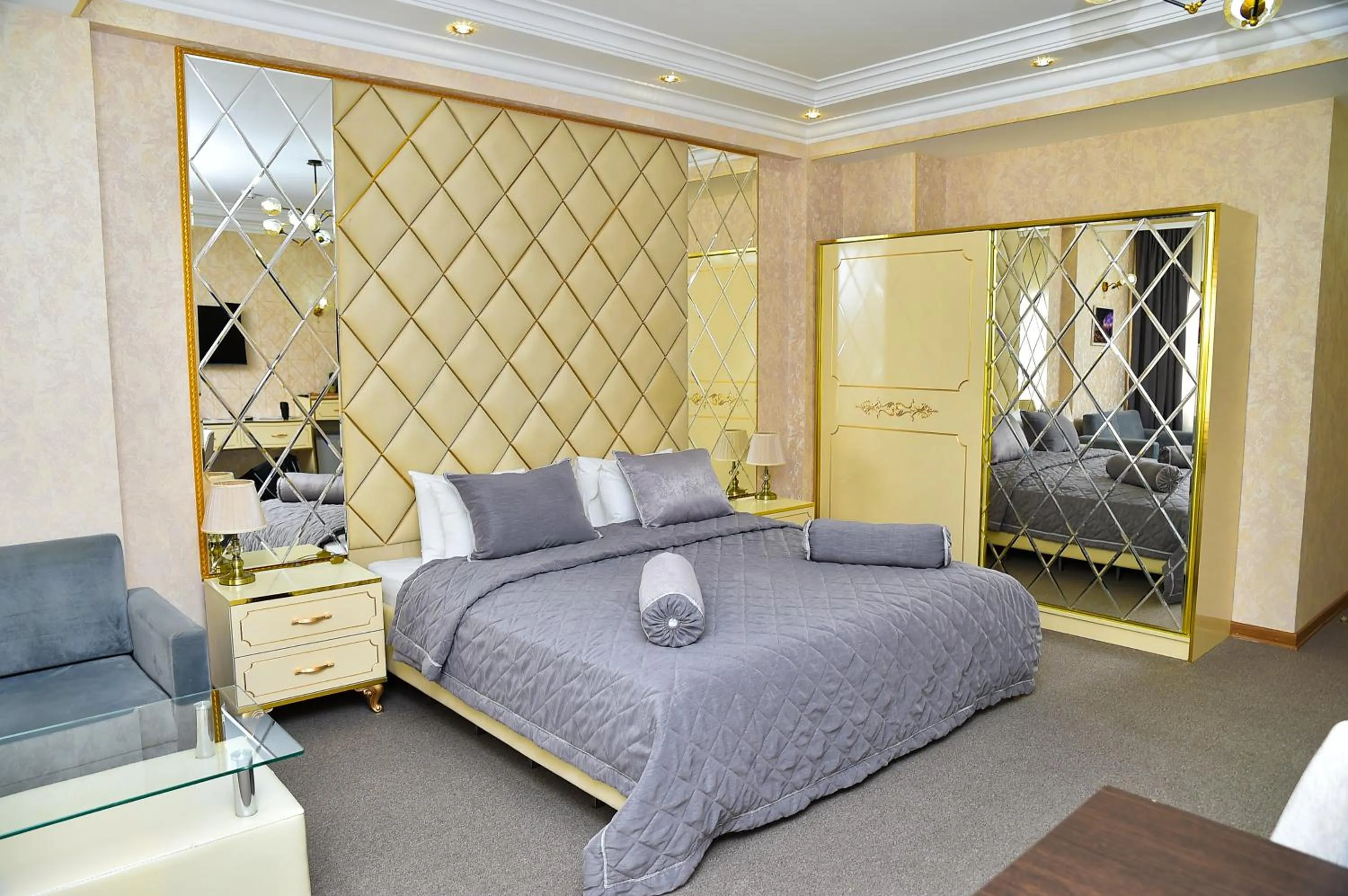 Bed in Karat Inn Boutique Hotel