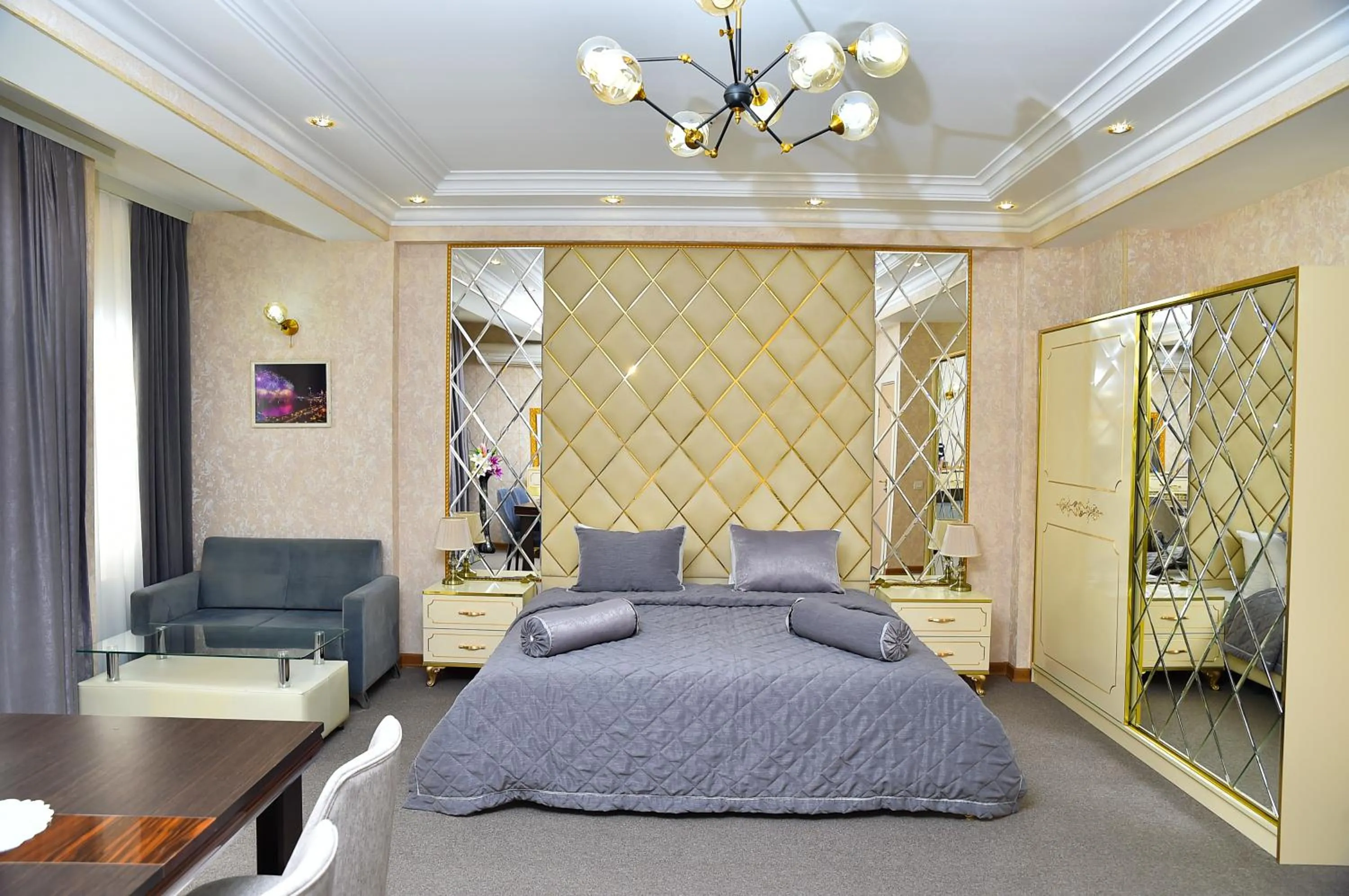 Bed in Karat Inn Boutique Hotel