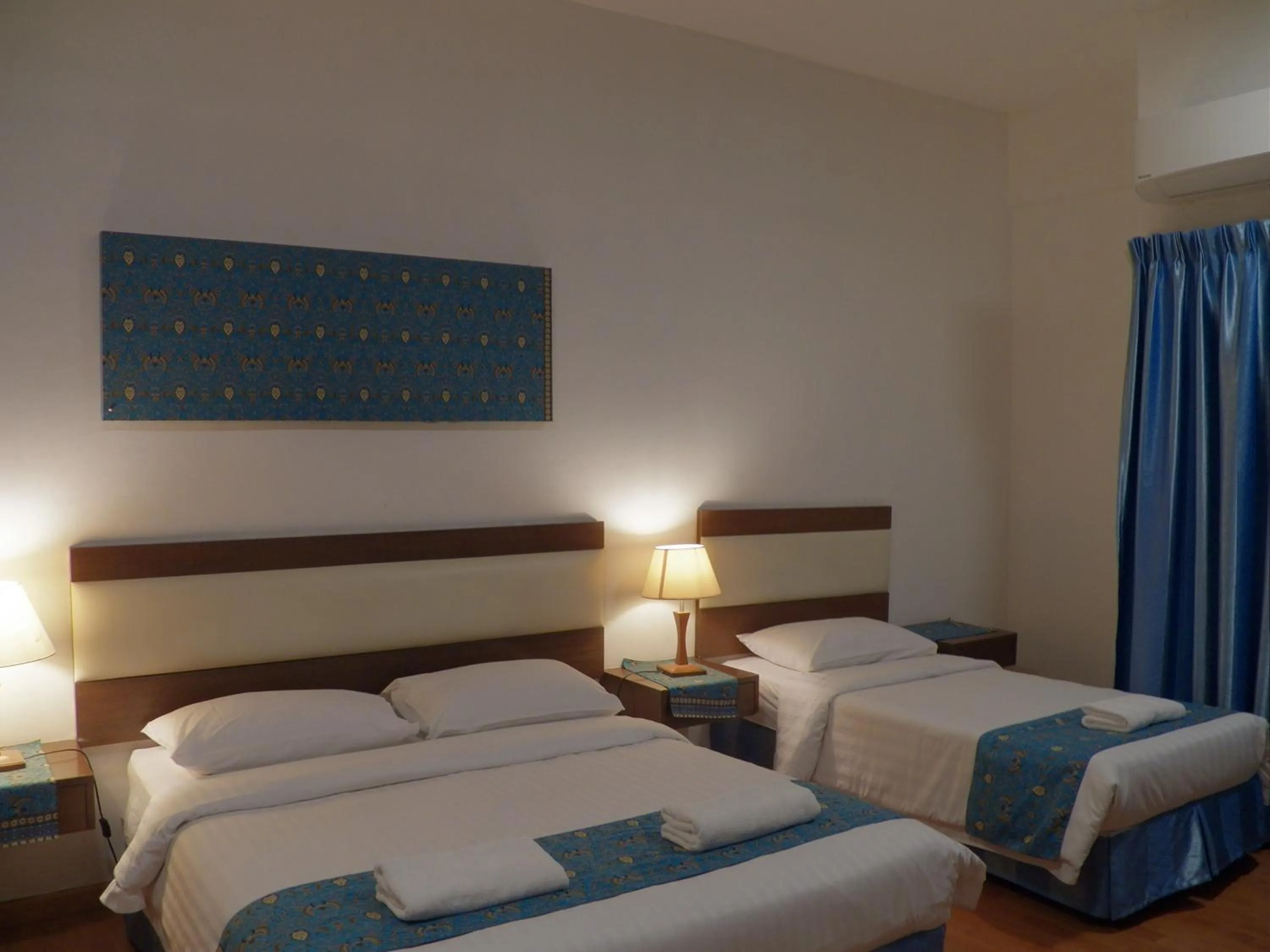 Bed in Maytower Apartment