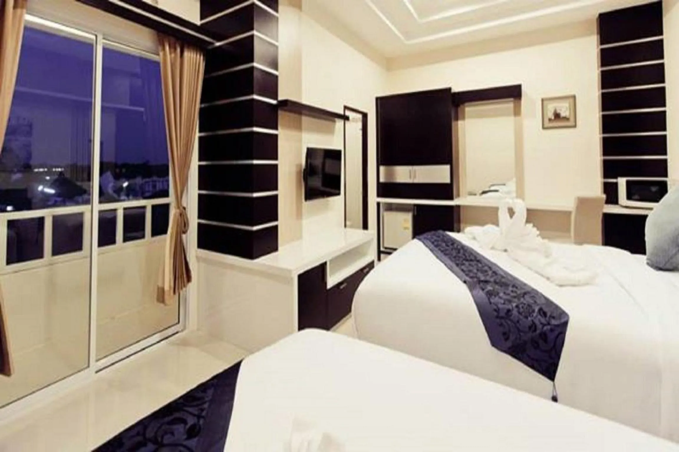 Bed in Excella Hotel