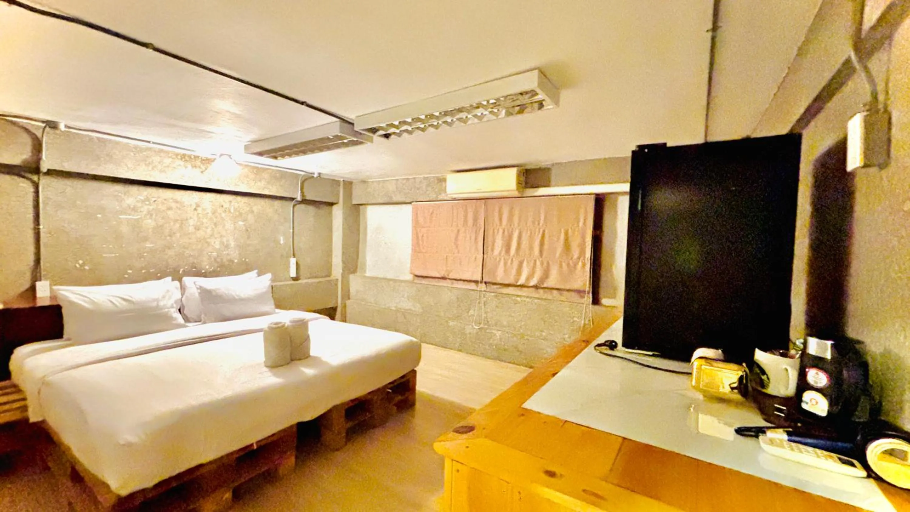 Bed in The Yak Cozy Chiang Mai