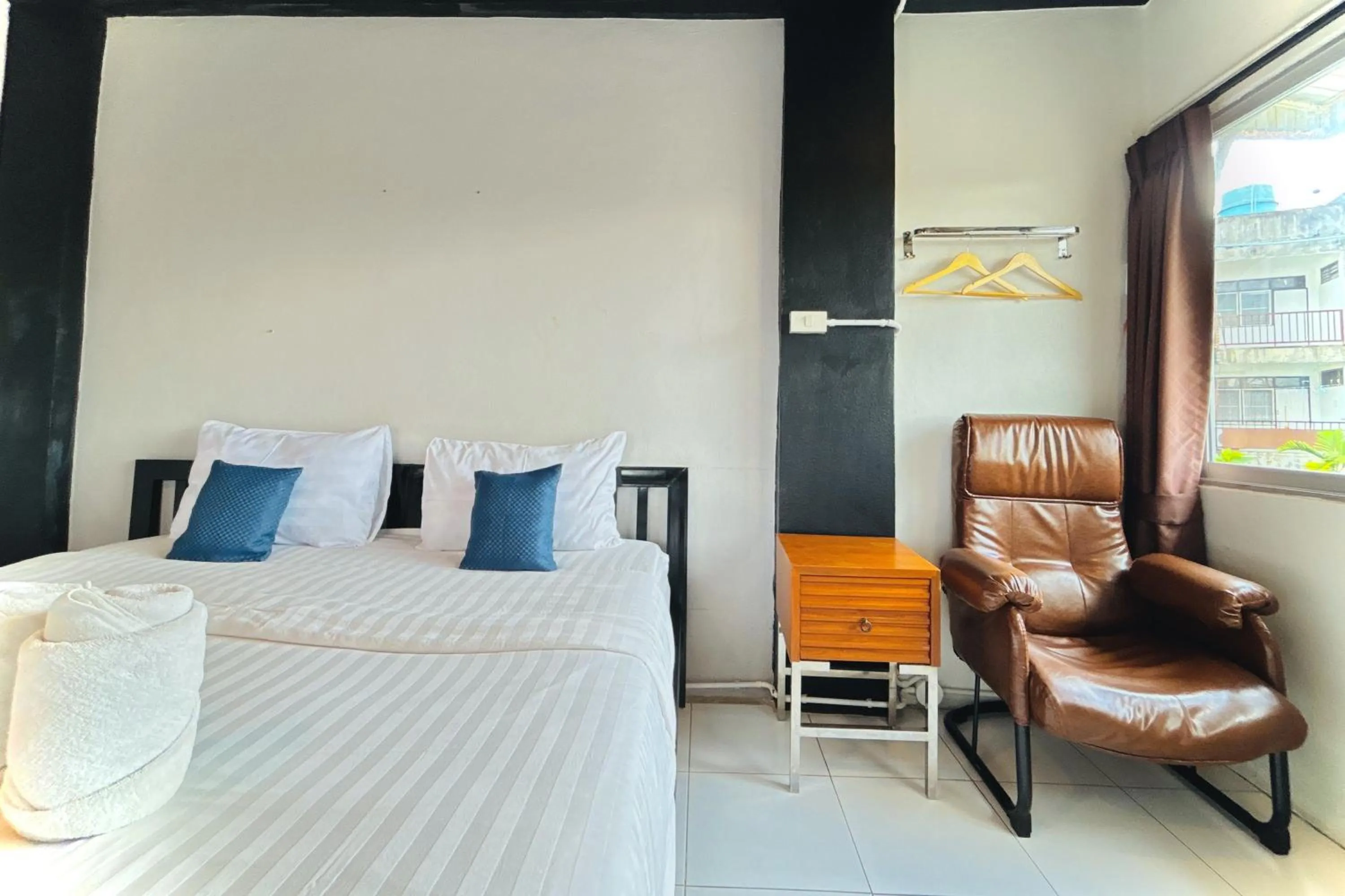 Bed in The Yak Cozy Chiang Mai