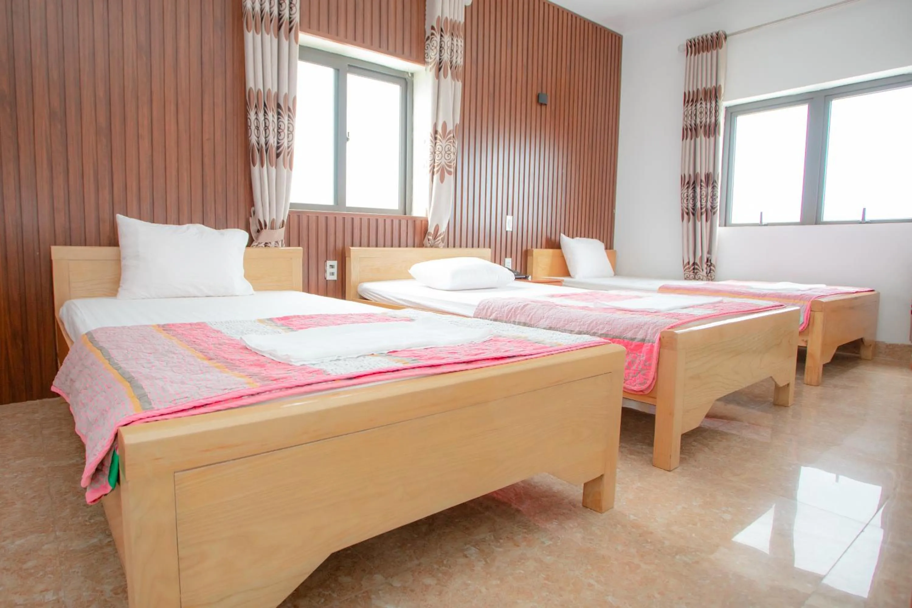 Bed in KHÁNH GIA HOTEL