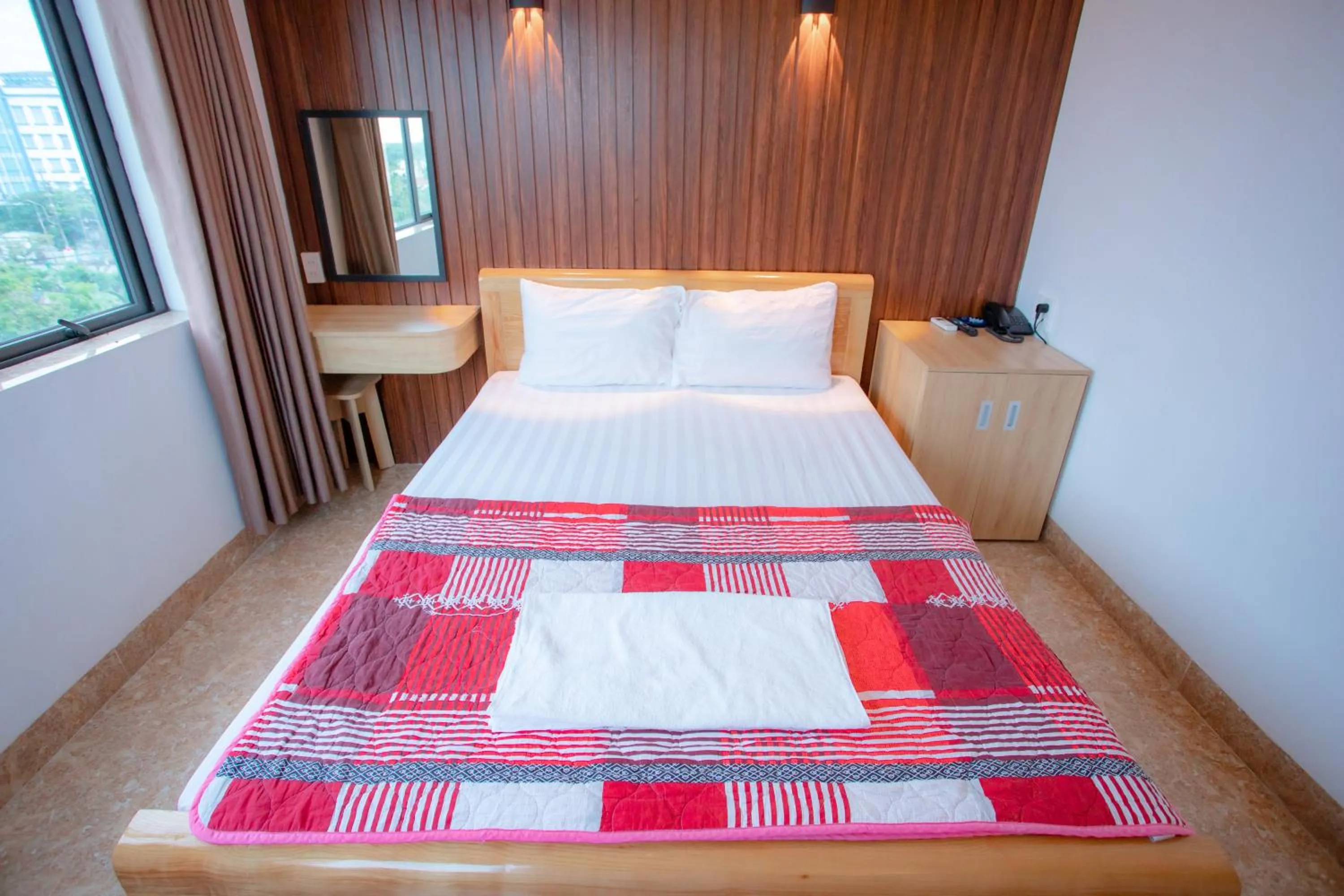 Bed in KHÁNH GIA HOTEL