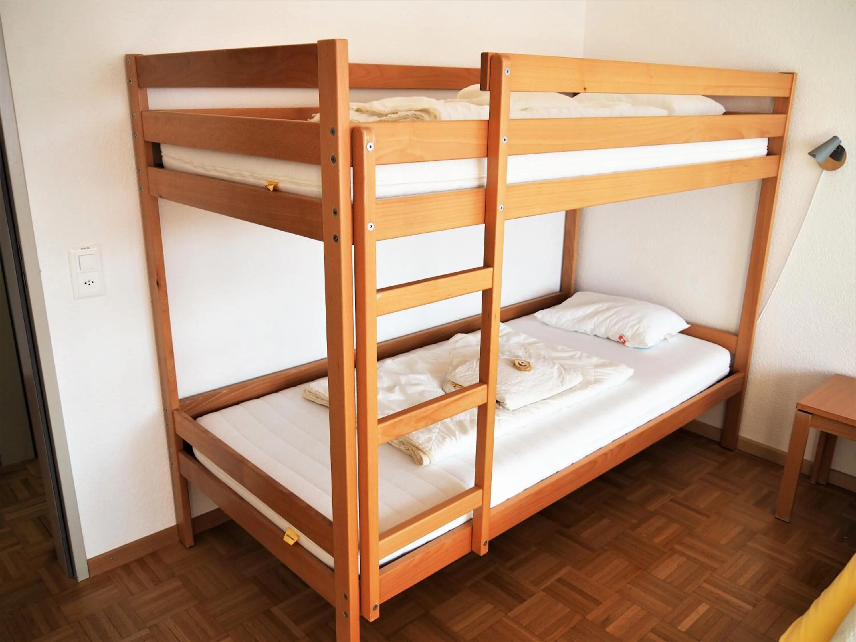 Single Bed in Male Dormitory Room in Jugendherberge Romanshorn