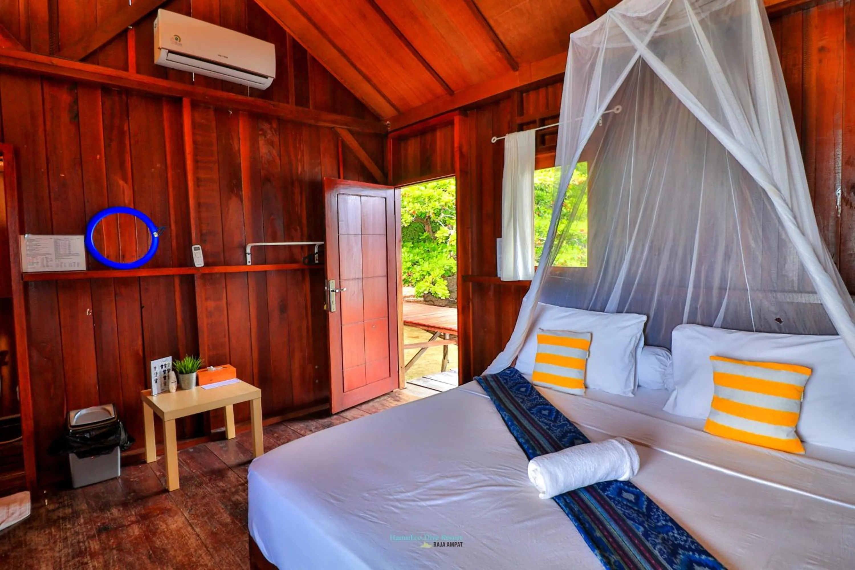 Bed in Hamueco Dive Resort Raja Ampat