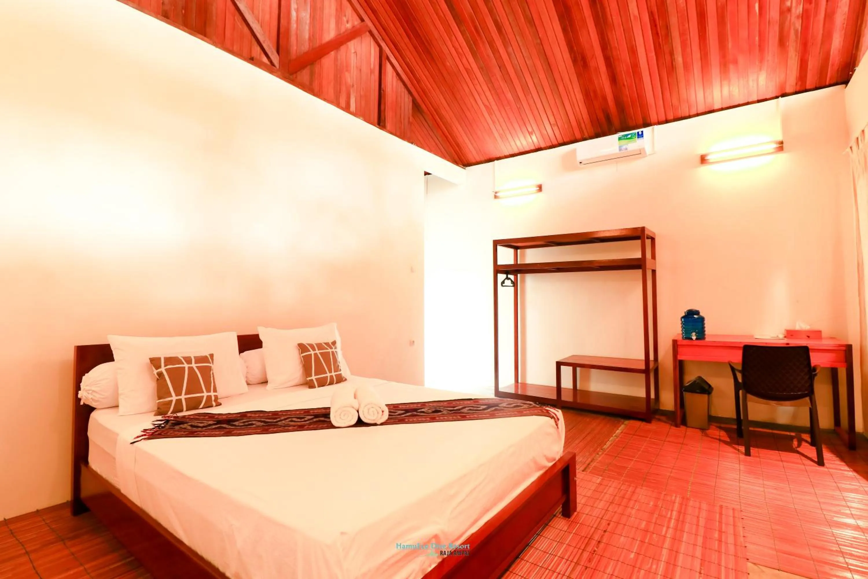 Bed in Hamueco Dive Resort Raja Ampat