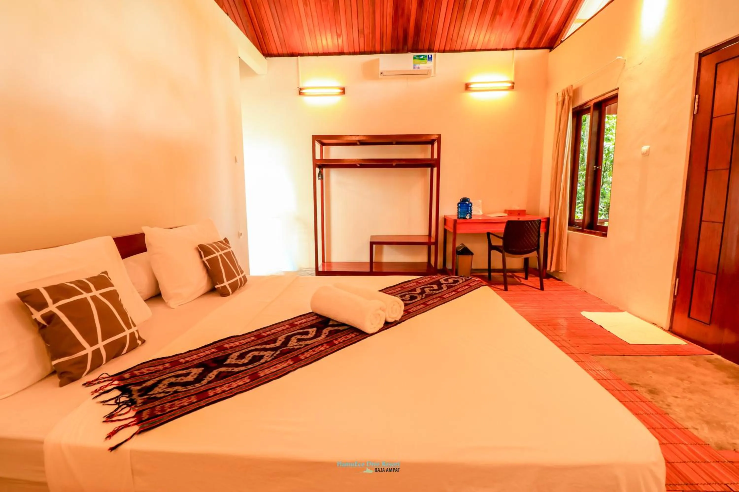Bed in Hamueco Dive Resort Raja Ampat