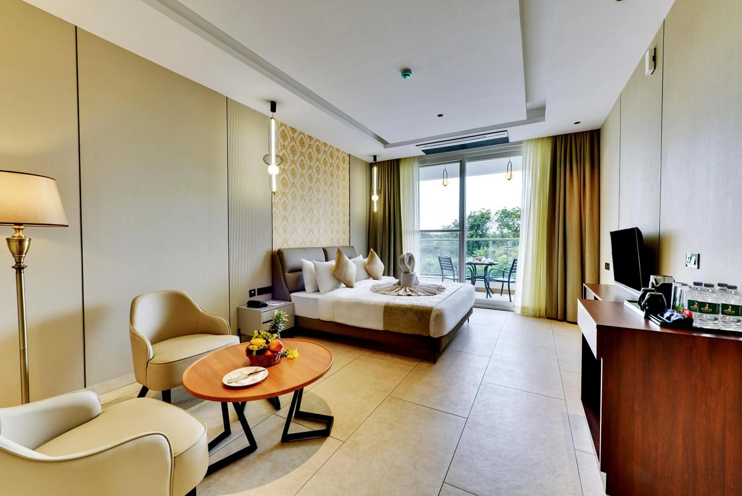 Seating area, Bed in Sportico Resort Bangalore