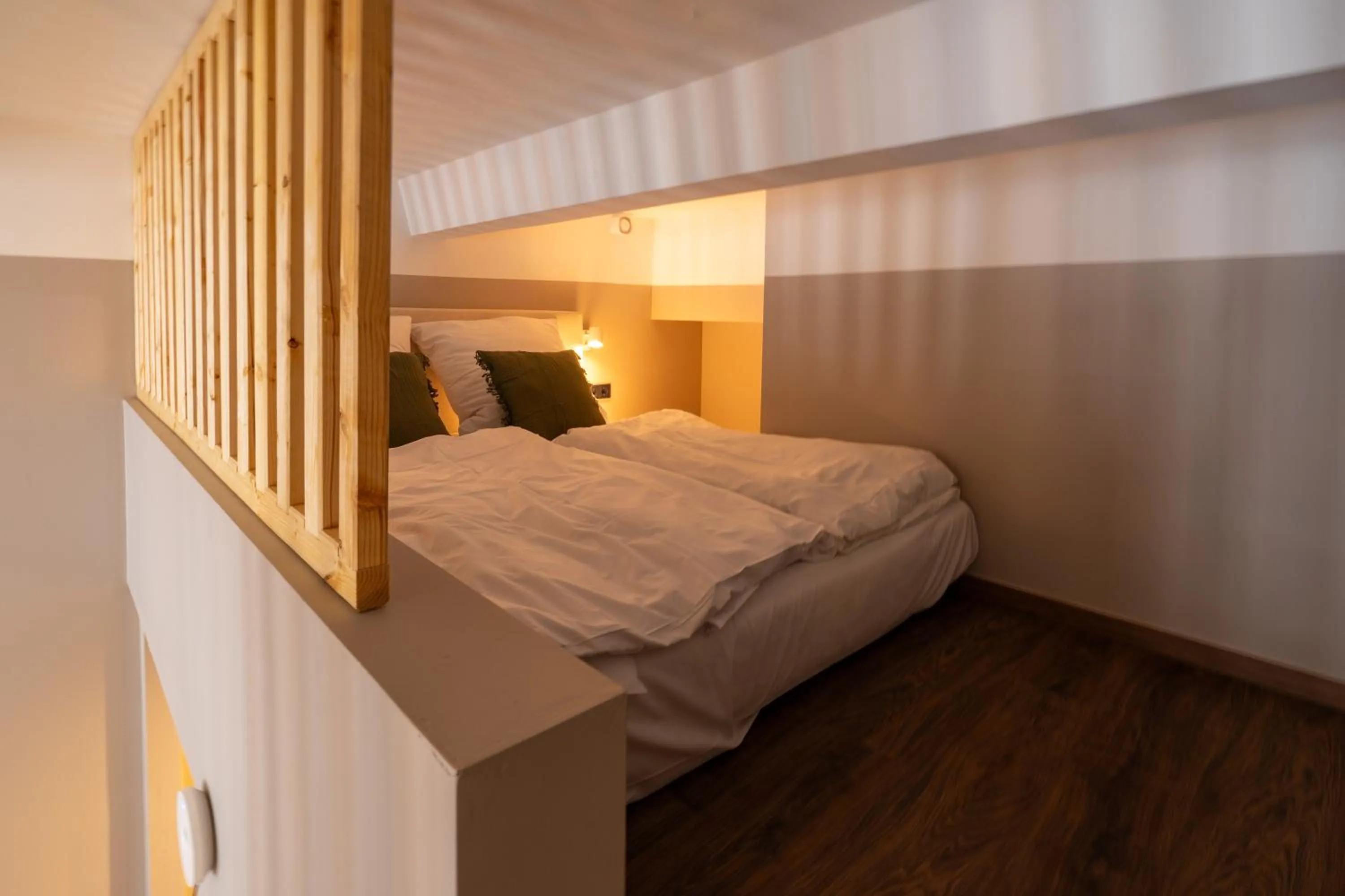 Bed in The Charming by Curt Suites