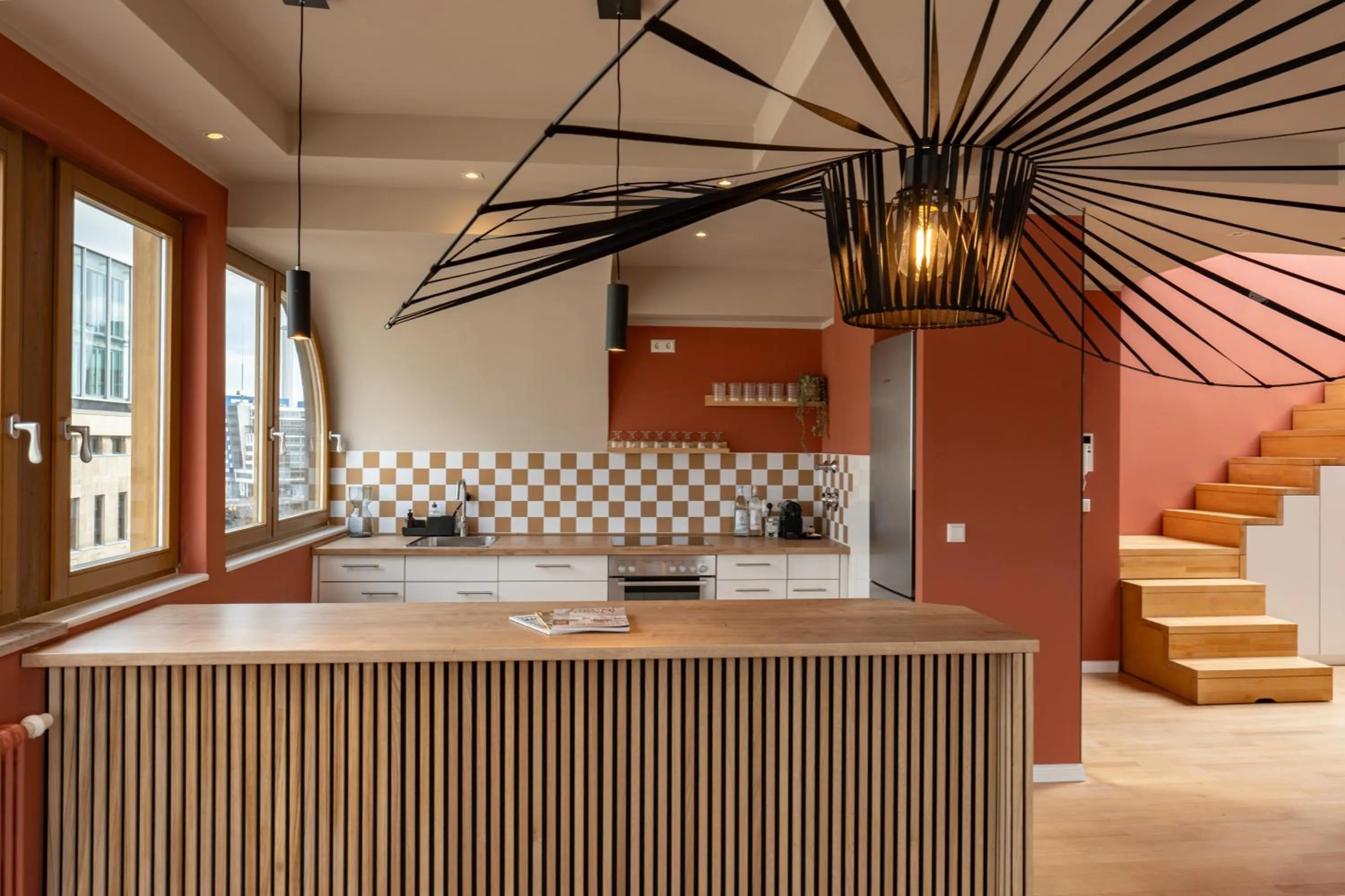 kitchen in The Charming by Curt Suites