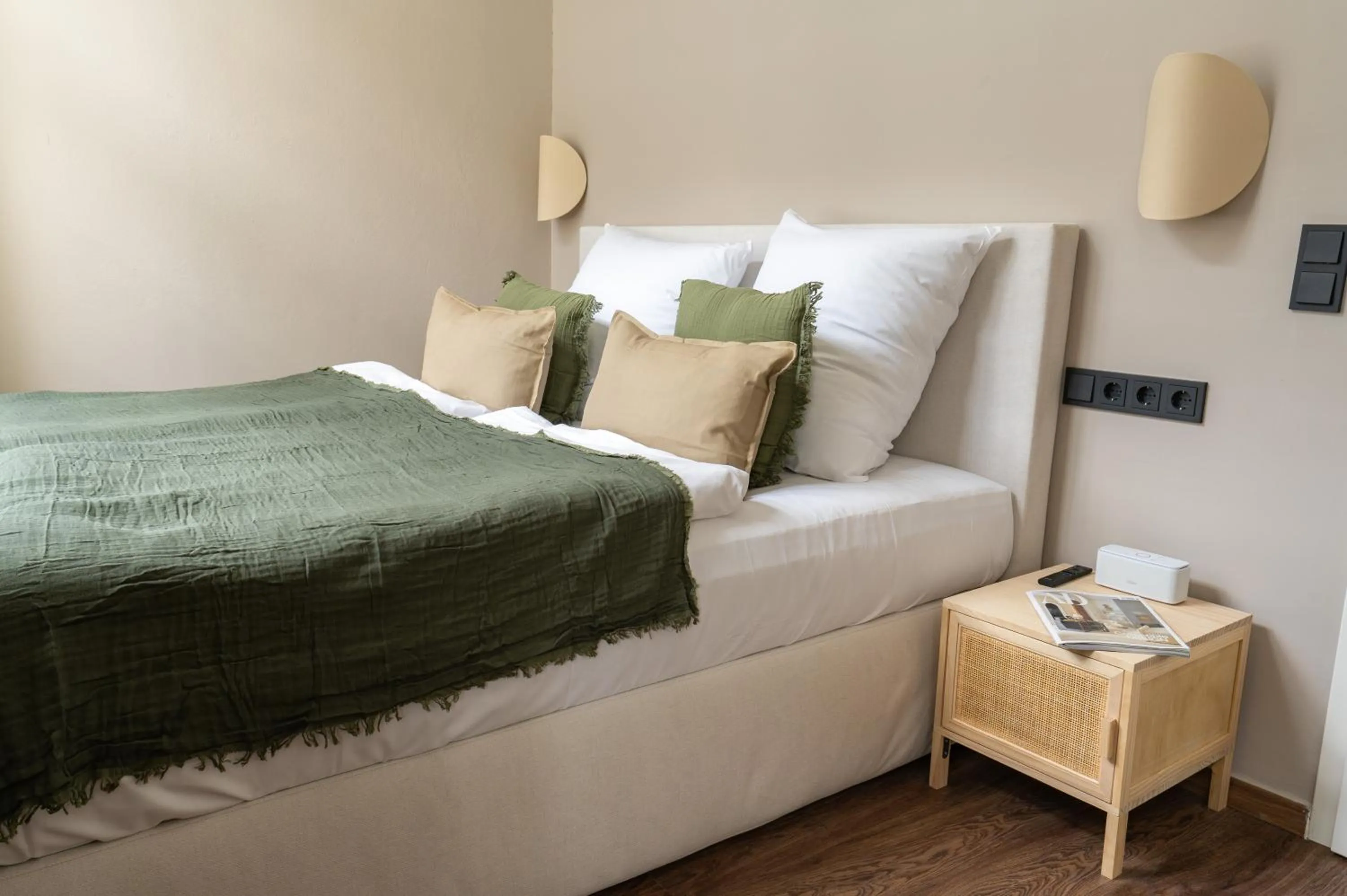 Bed in The Charming by Curt Suites