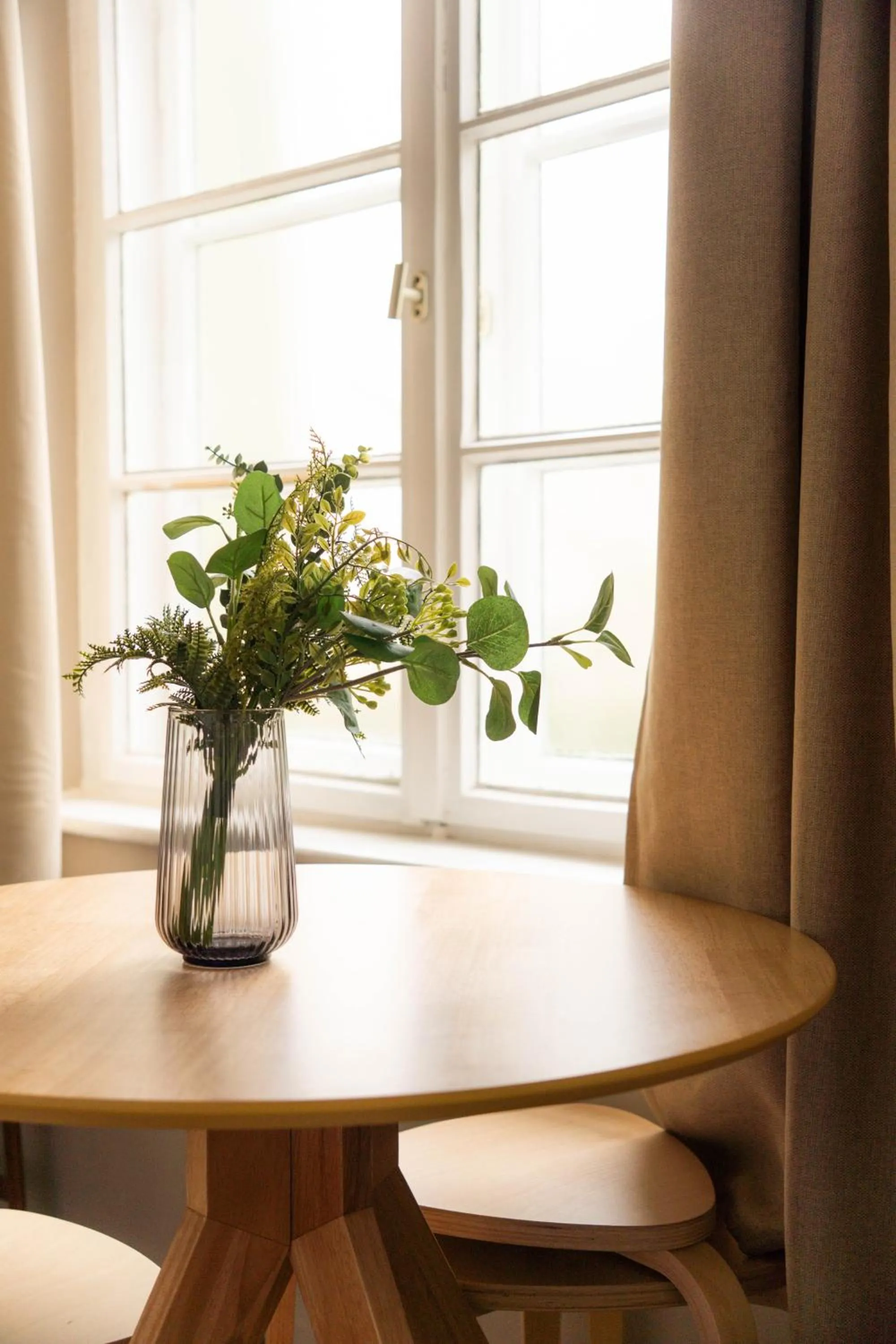 Seating area in The Charming by Curt Suites