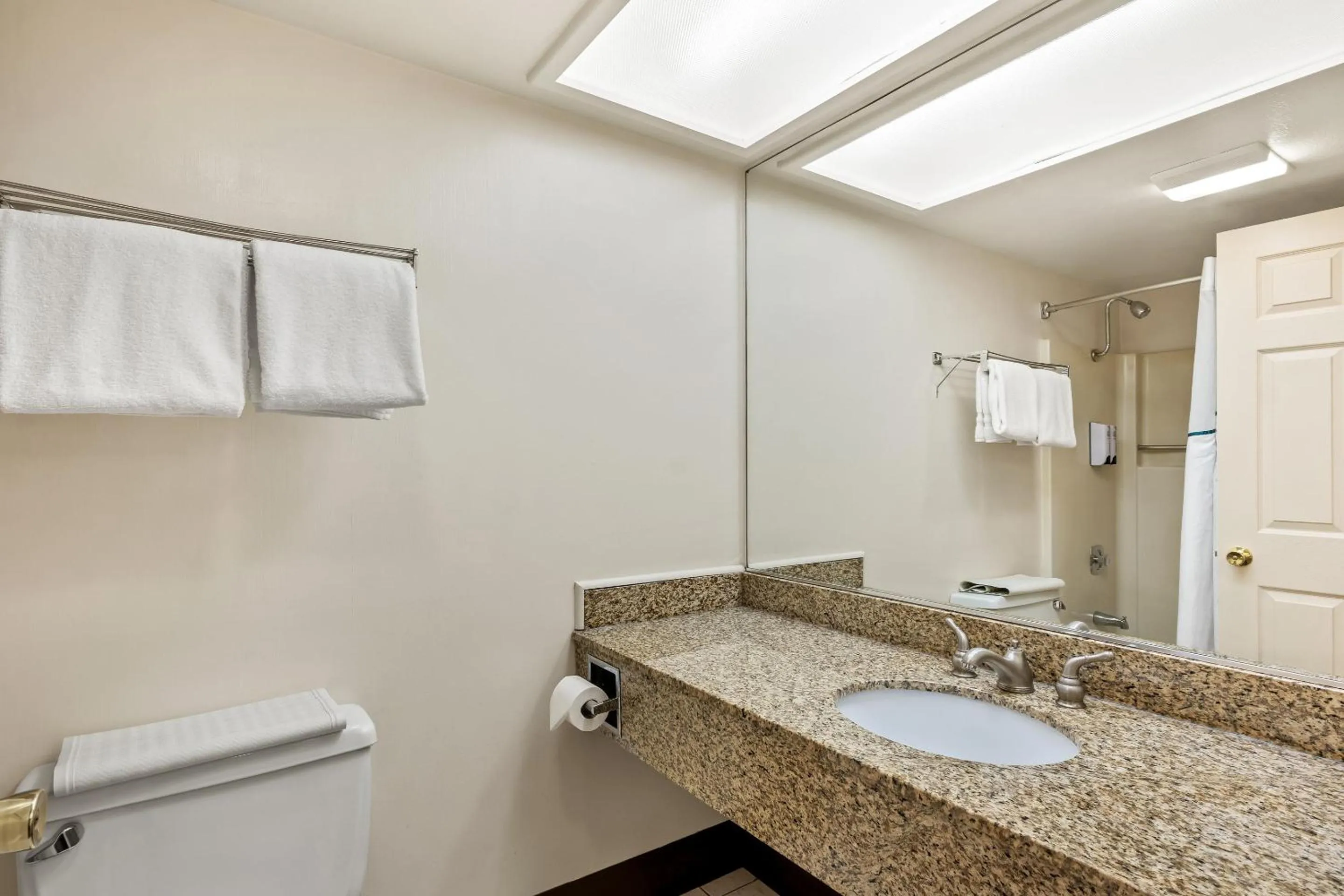 Bathroom in HomeTowne Studios by Red Roof Yuba City Bonanza - Marysville