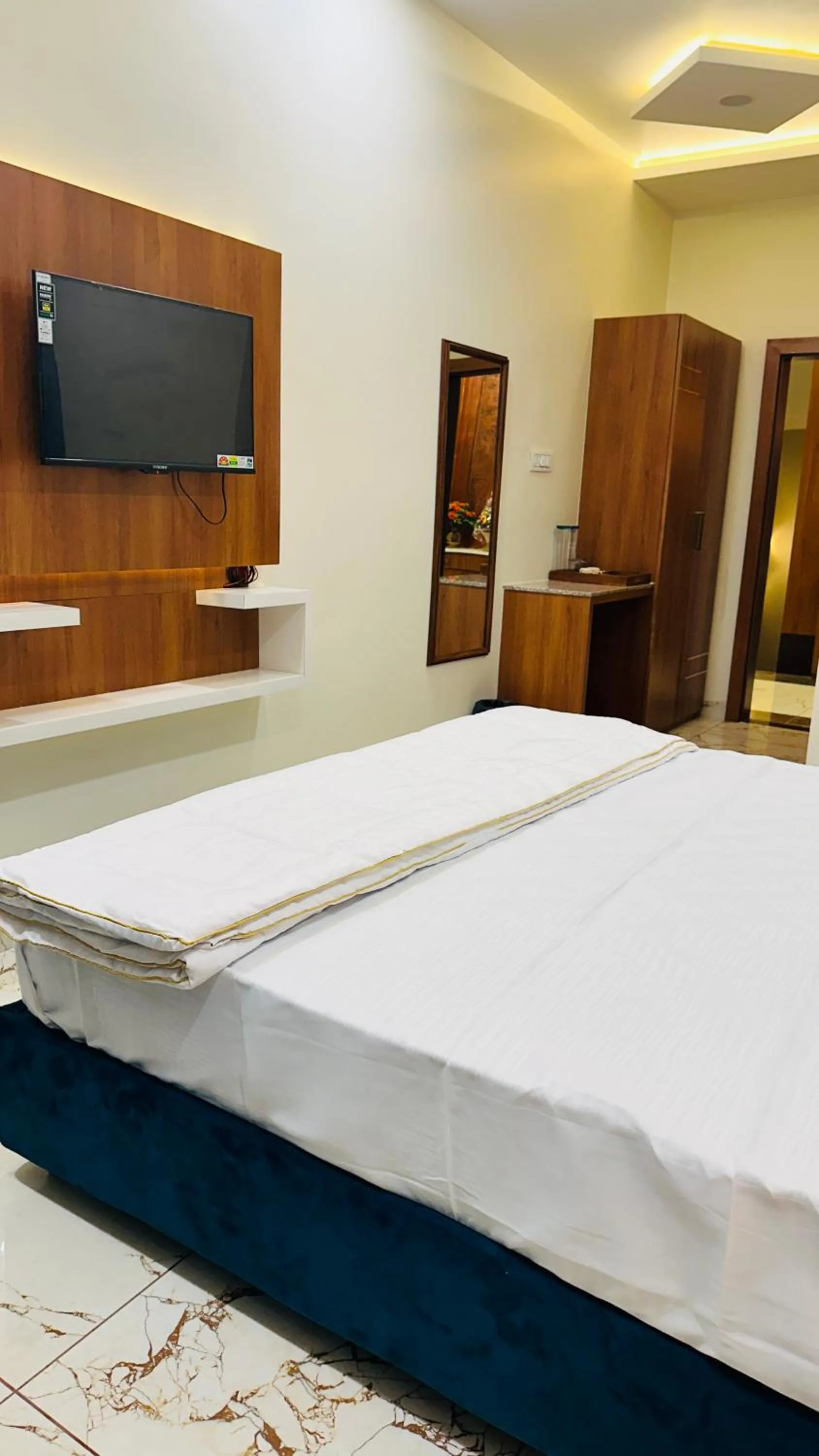 Bed in Hotel Ratnam Palace Maheshwar