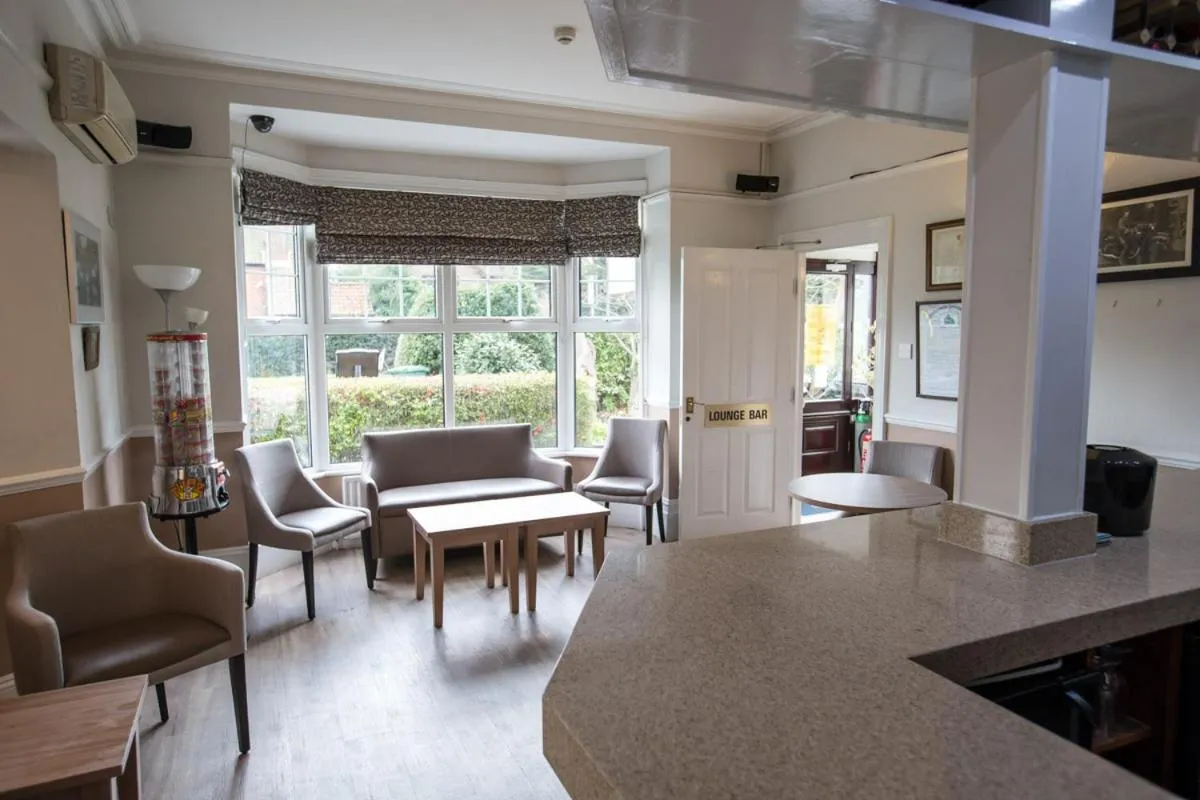 Communal lounge/ TV room in Corner House Hotel Gatwick with bookable Holiday parking