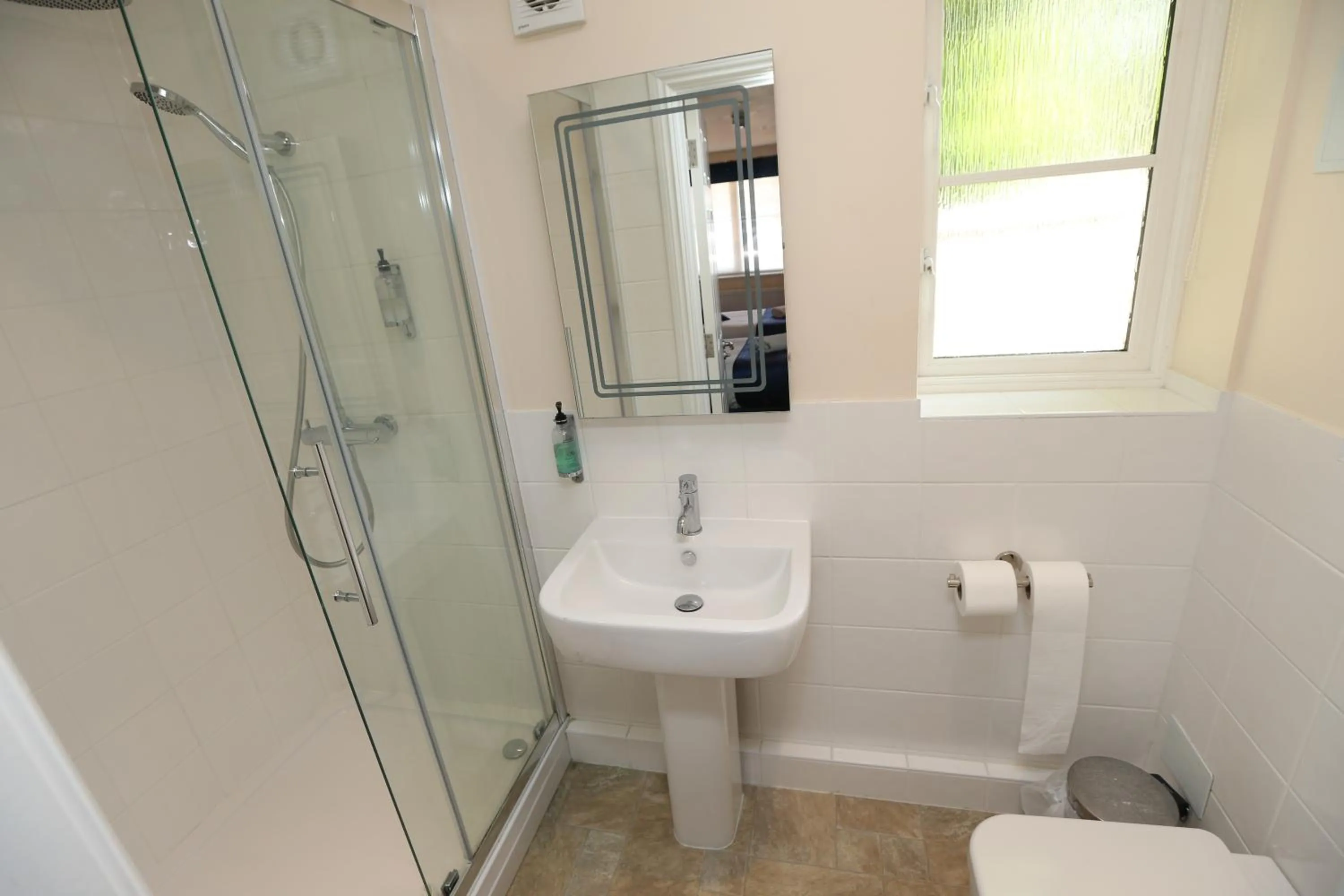 Bathroom in Corner House Hotel Gatwick with bookable Holiday parking