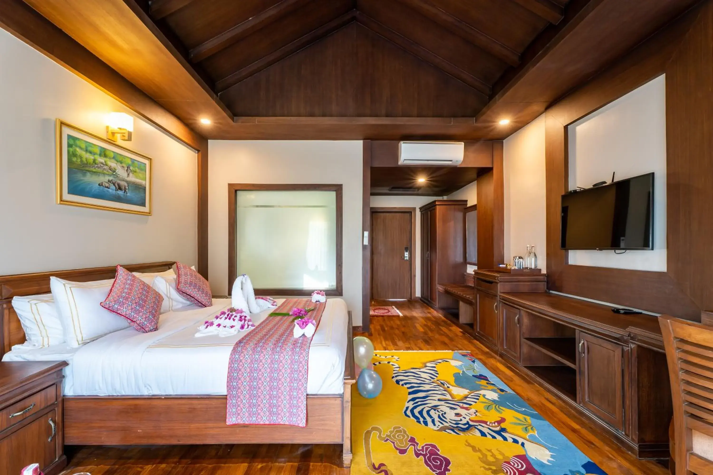 TV and multimedia, Bed in River Bank Jungle Resort, Chitwan TV and multimedia, Bed in River Bank Jungle Resort, Chitwan