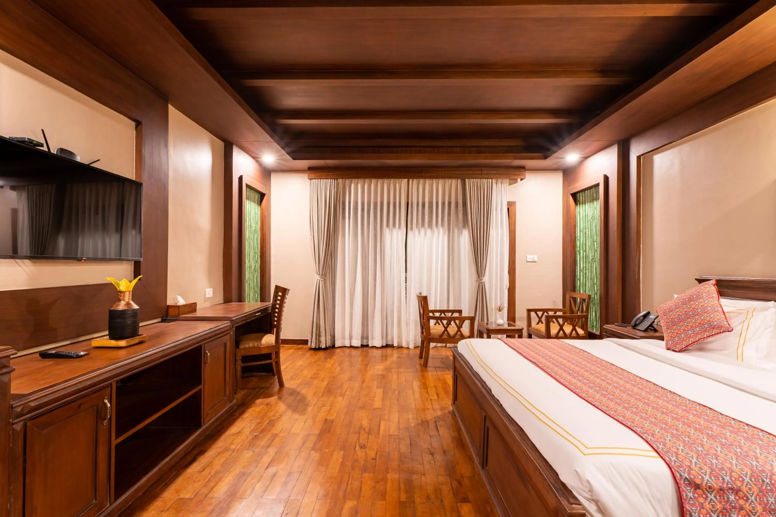 Bed in River Bank Jungle Resort, Chitwan