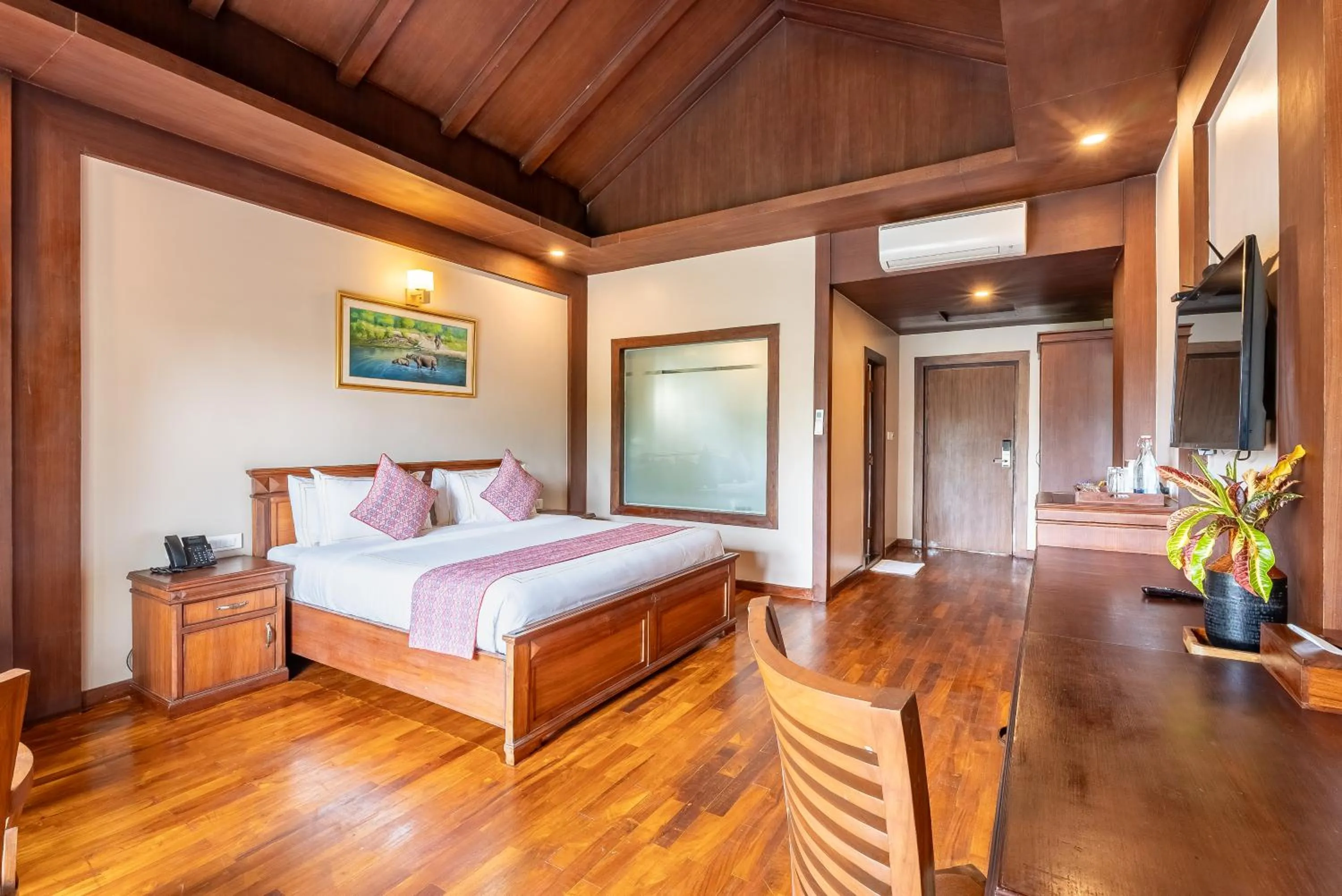 Bed in River Bank Jungle Resort, Chitwan