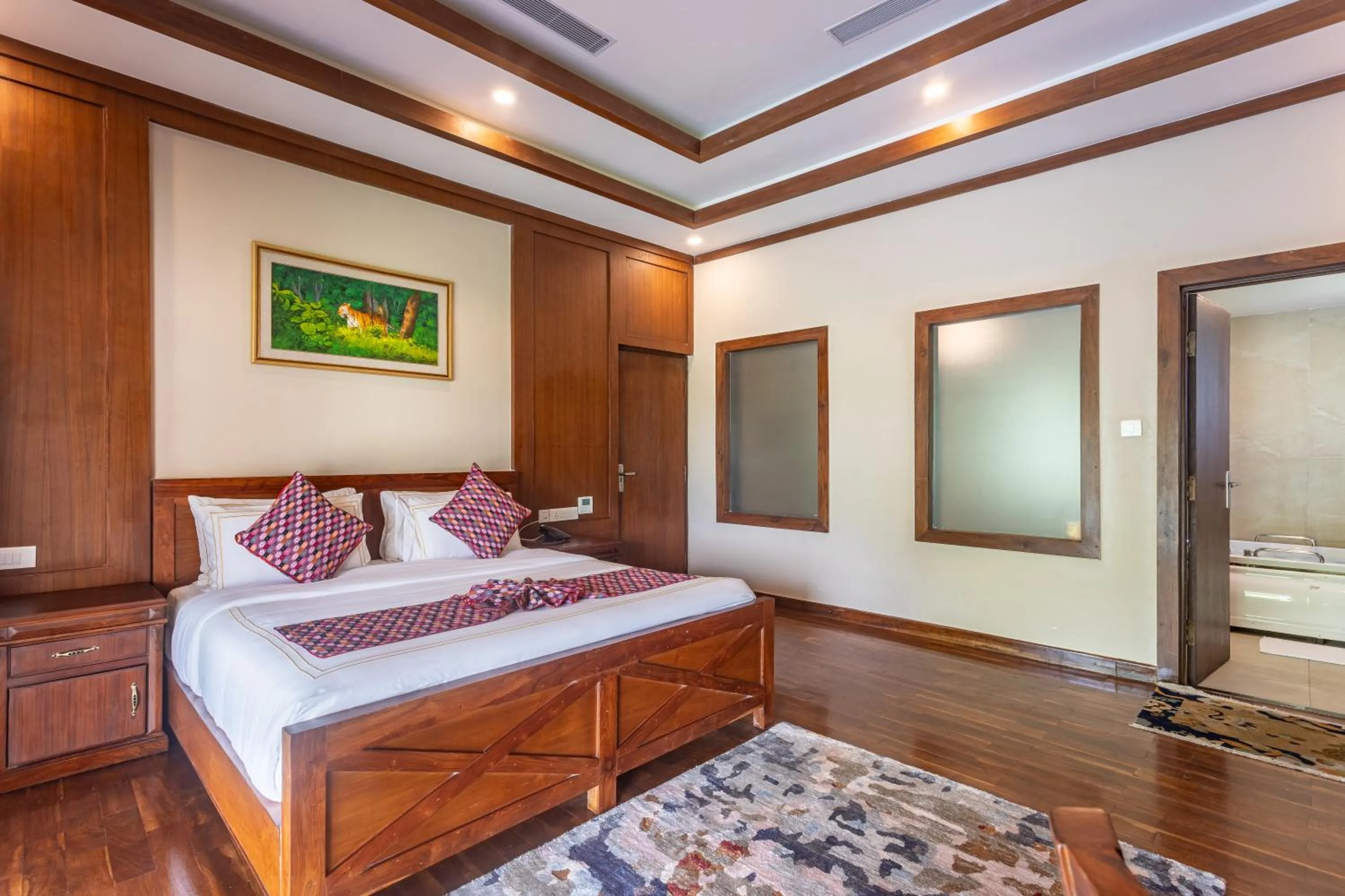 Bed in River Bank Jungle Resort, Chitwan