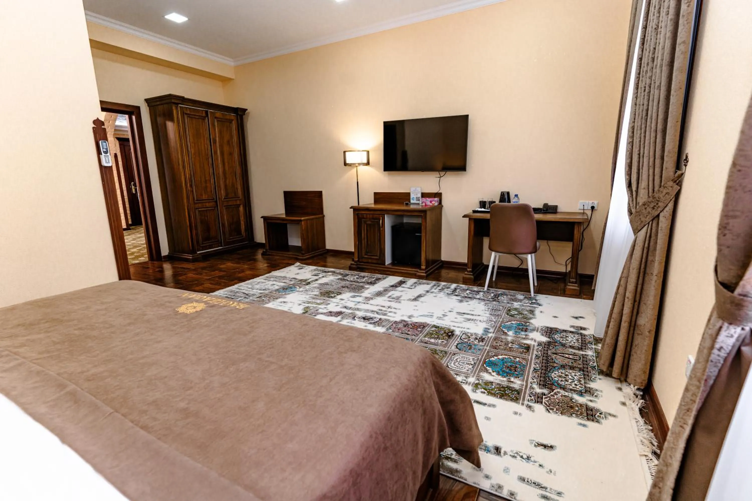 Communal lounge/ TV room, Bed in Bagizagan Hotel