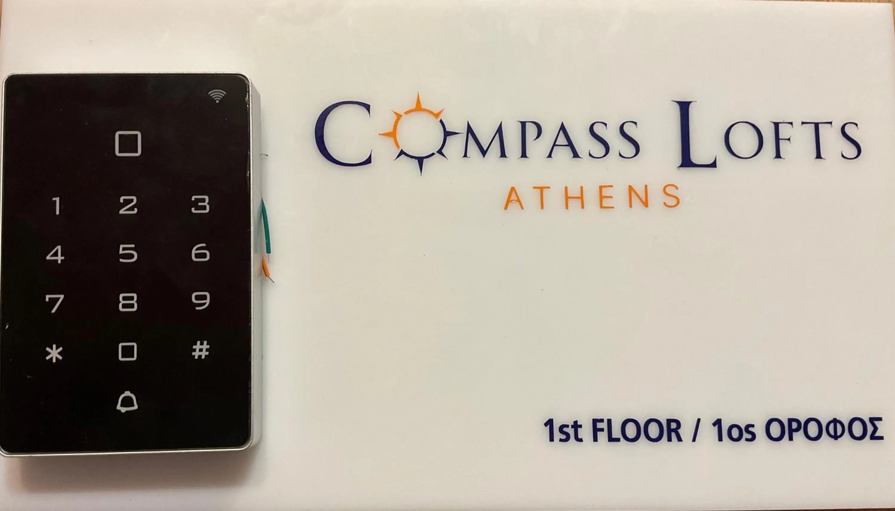 Logo/Certificate/Sign in Compass Lofts Athens