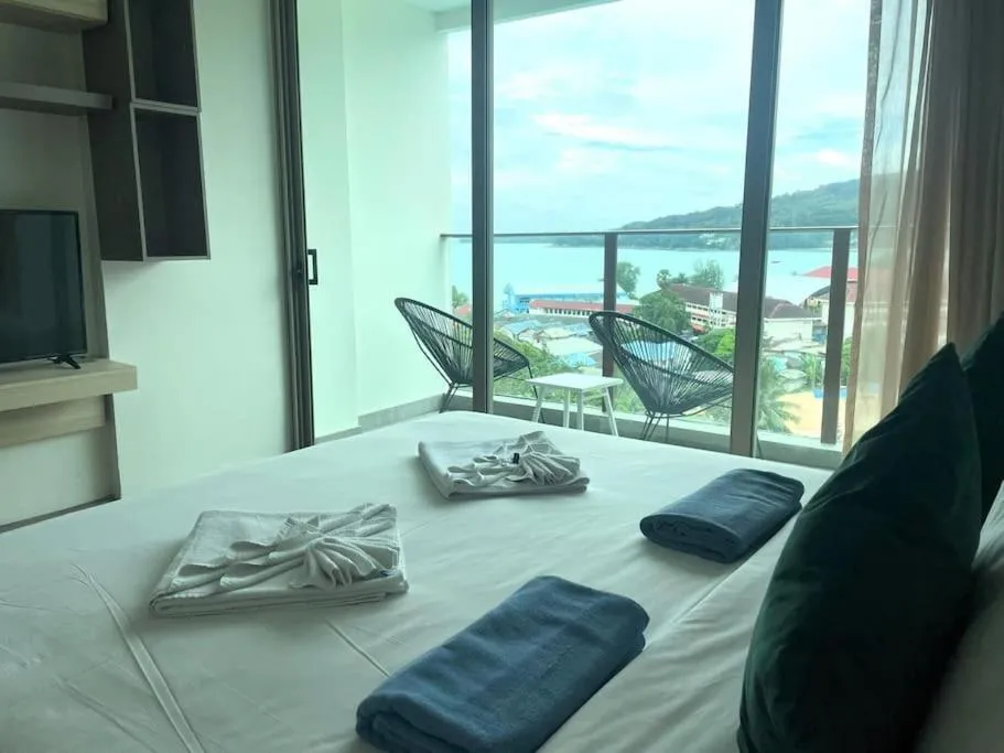 Bed in Sea view apartment at Oceana by Lofty