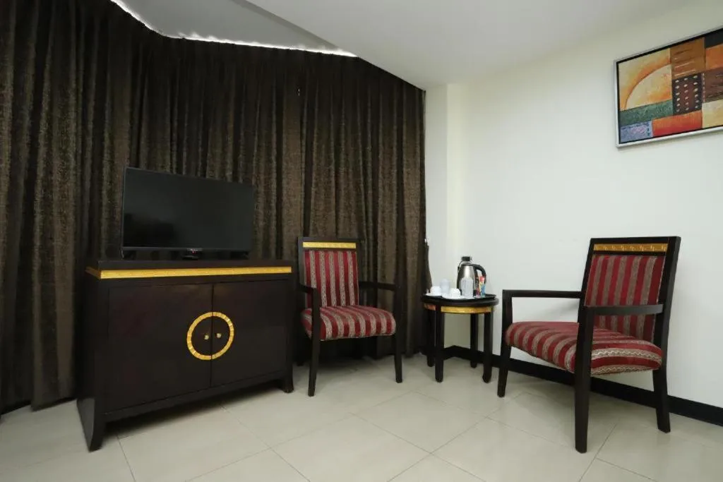 Communal lounge/ TV room, Seating Area in Lucky Palace Hotel