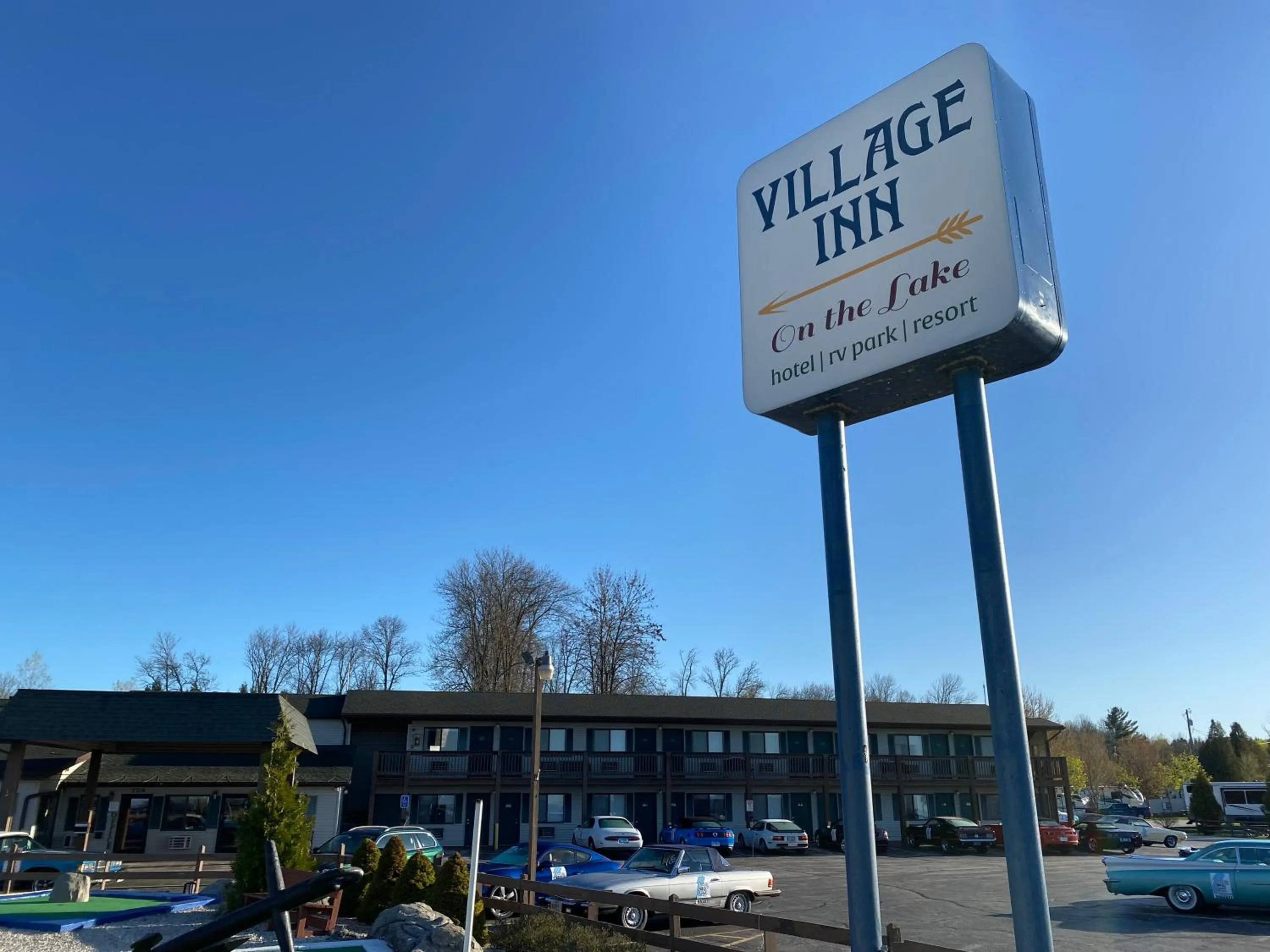 Property logo or sign in Village Inn on the Lake