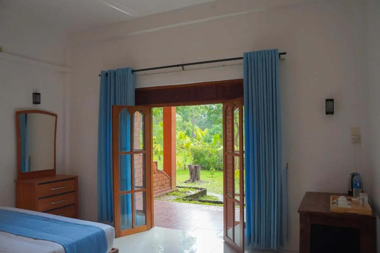 Bed in Sigiriya Cottage