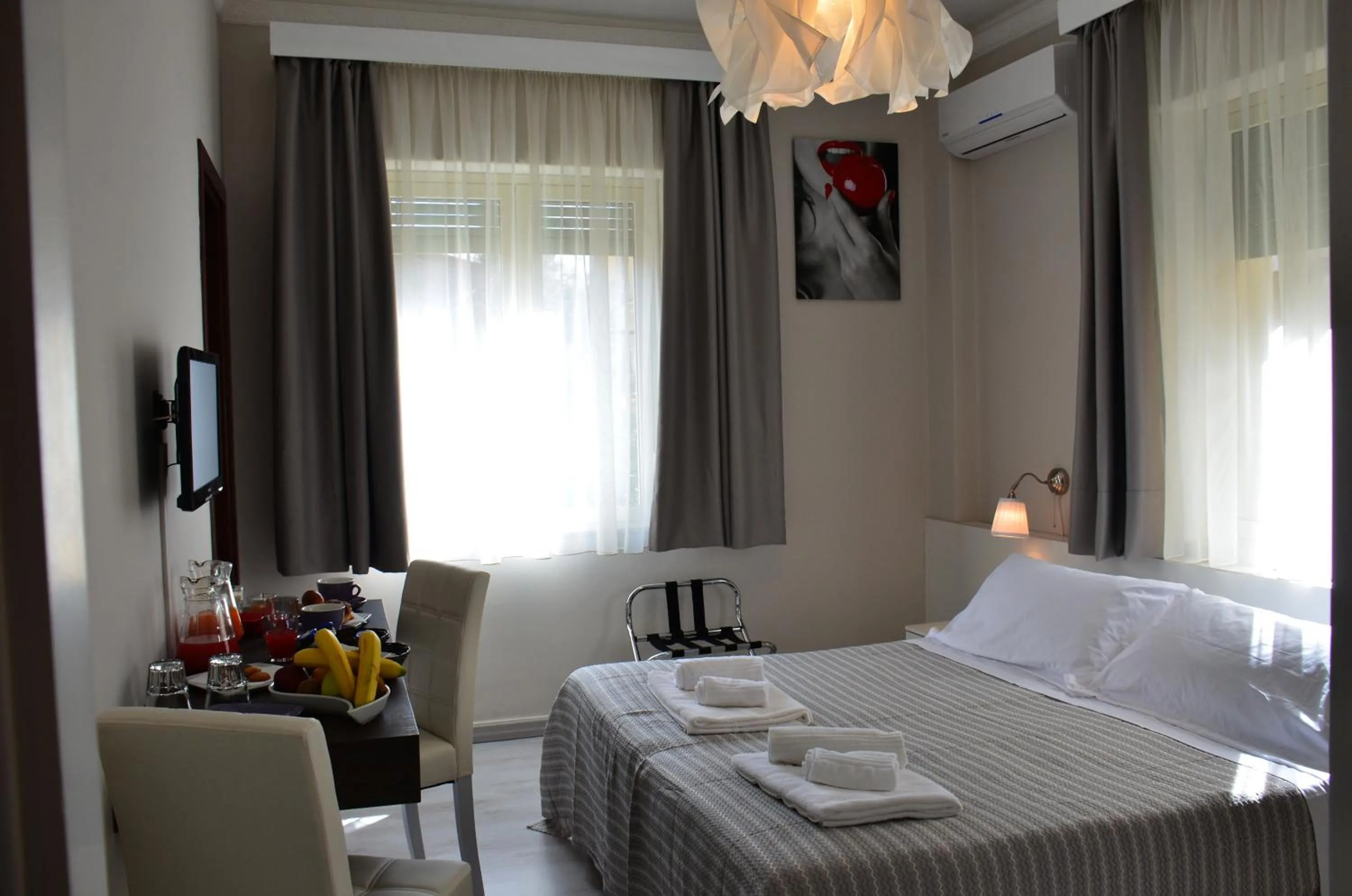 Bed in Athena Charming Rooms