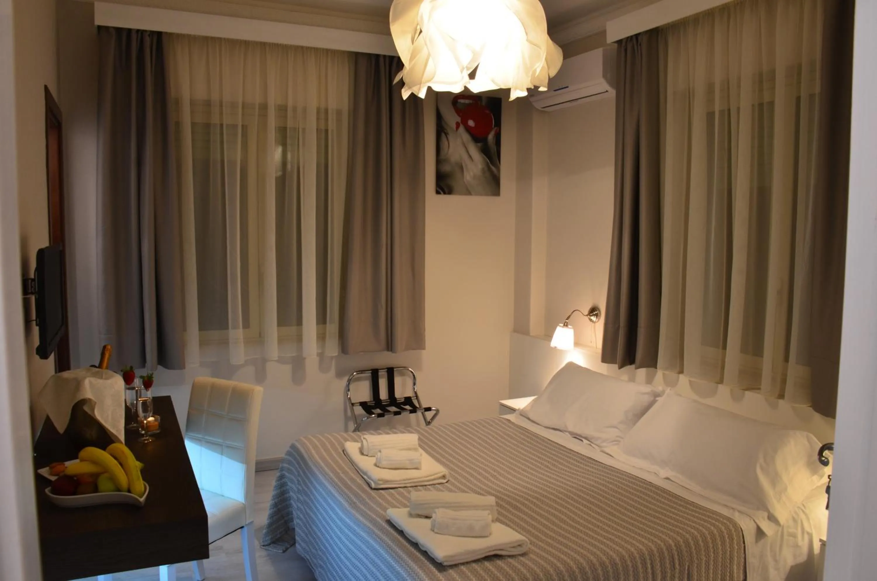 Bed in Athena Charming Rooms