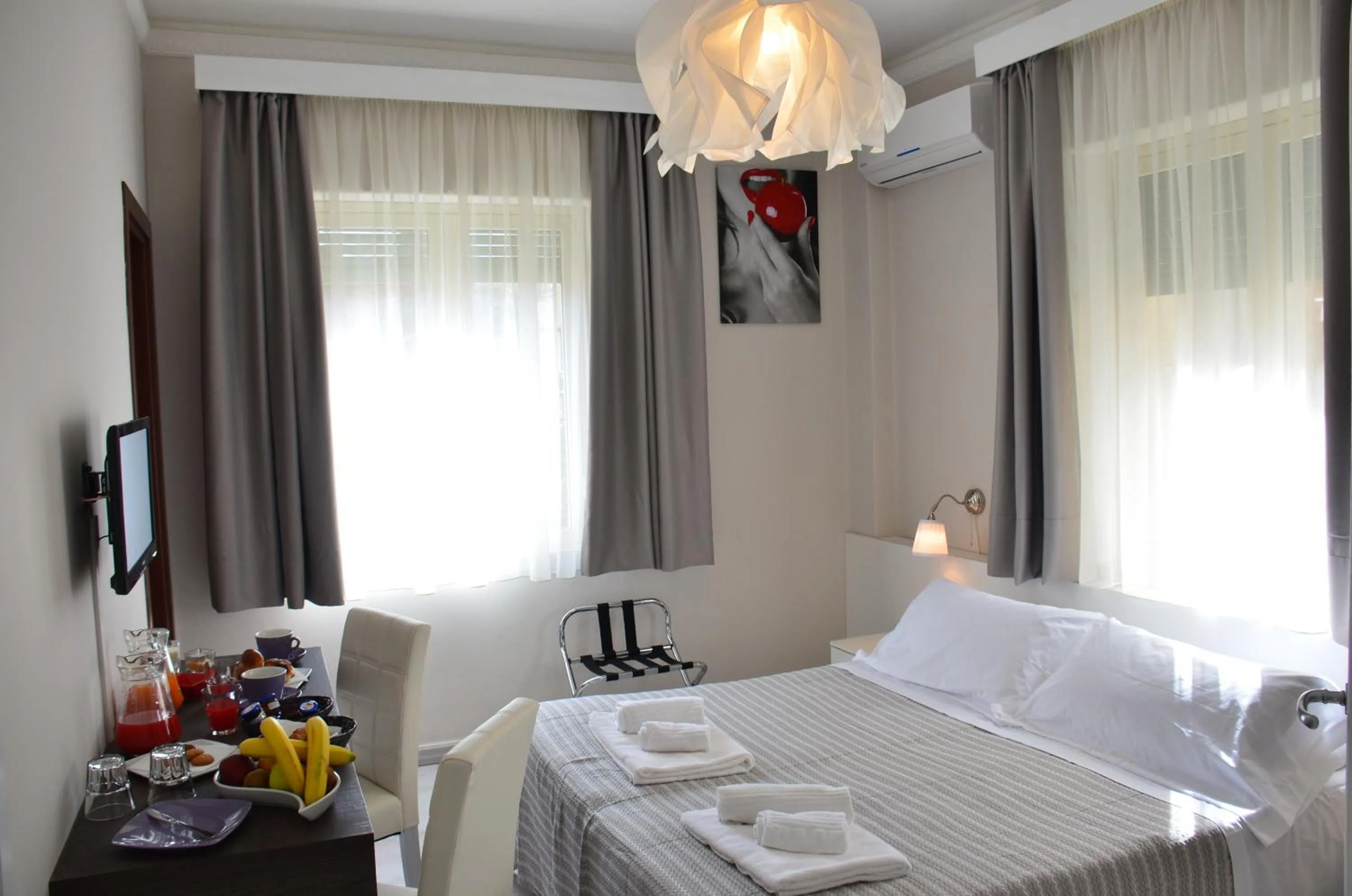 Bed in Athena Charming Rooms