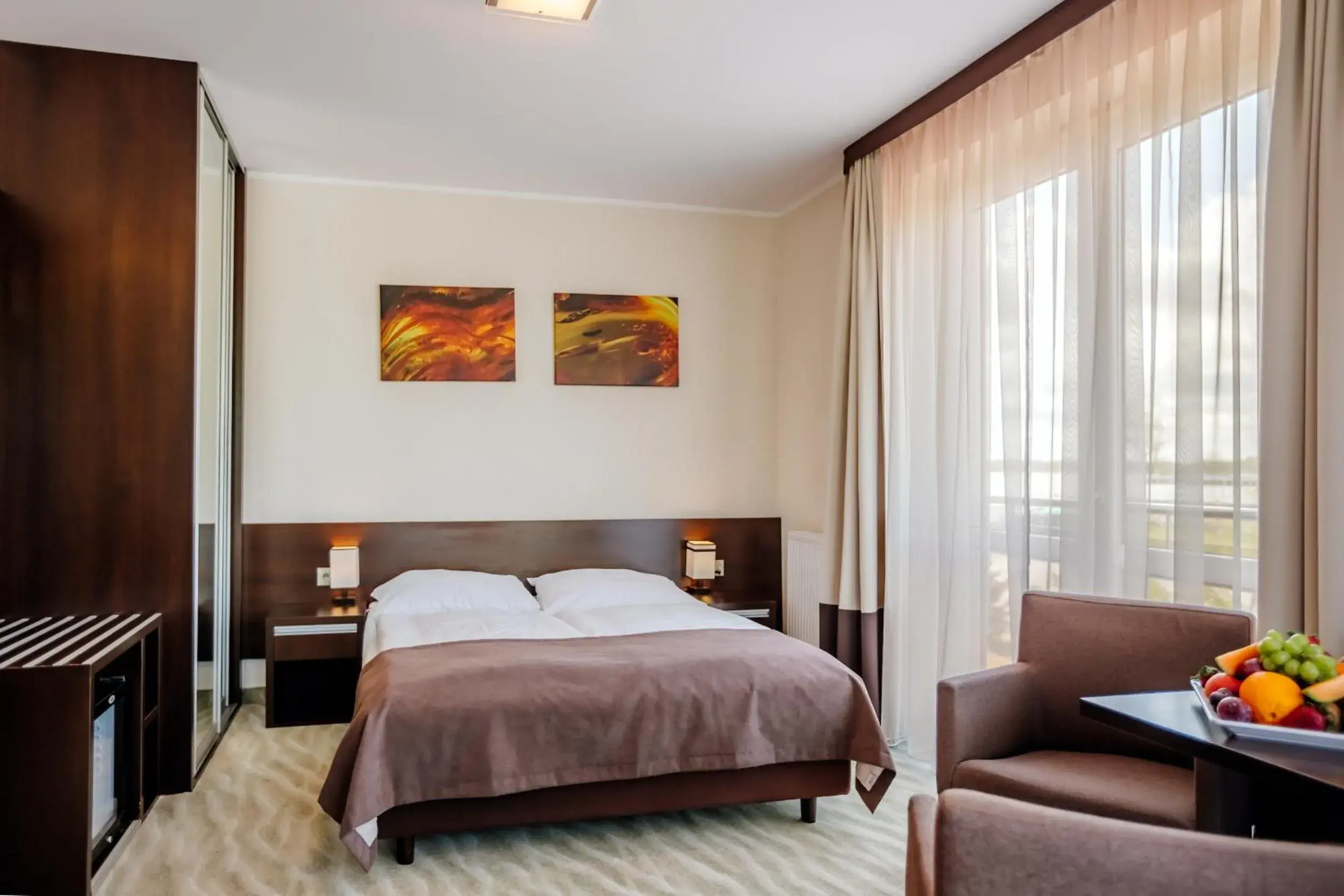 Family Room with Balcony and Partial Lake View in Hotel Emocja SPA Family Room with Balcony and Partial Lake View in Hotel Emocja SPA