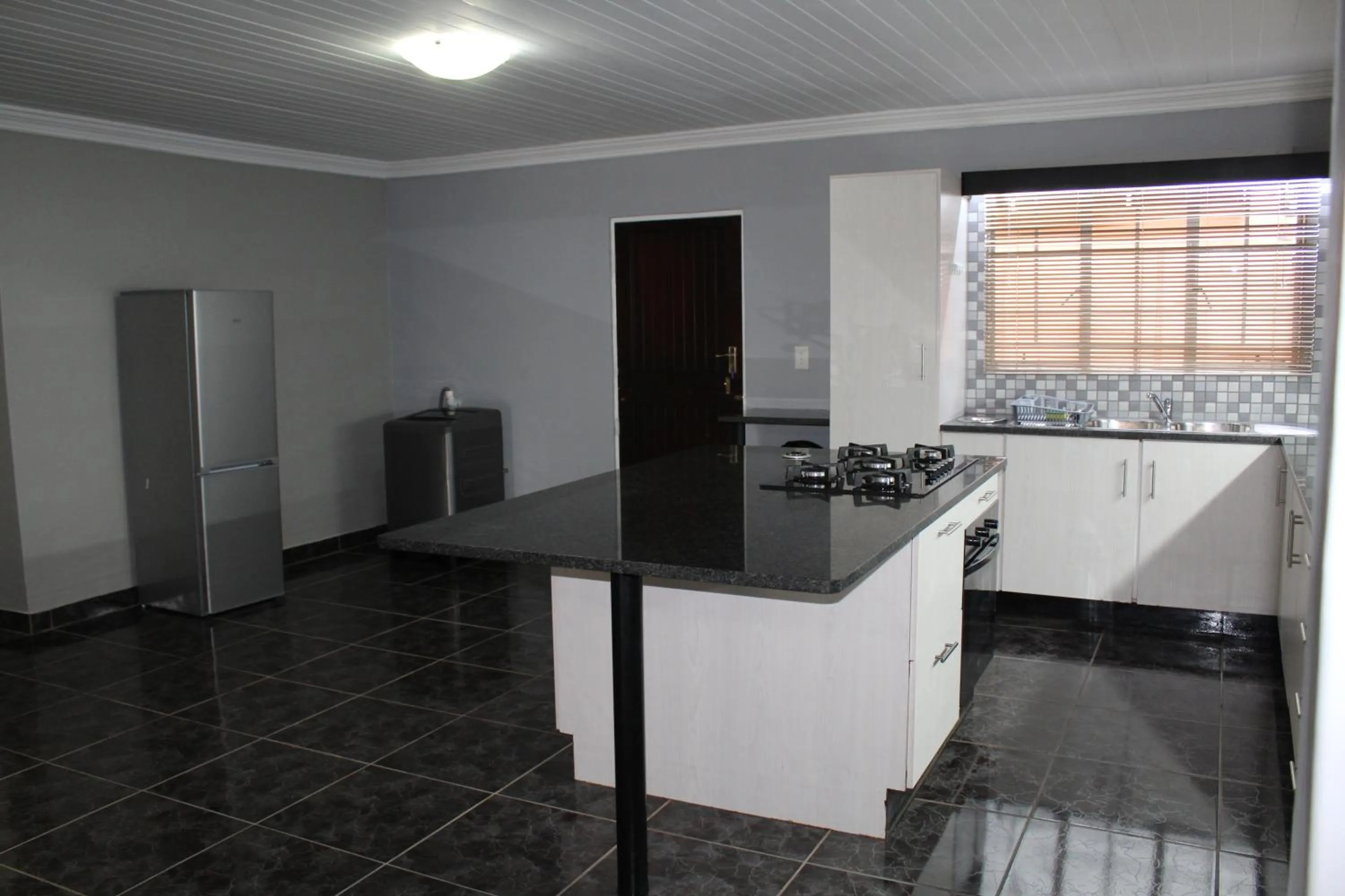Kitchen or kitchenette in El Gran Chaparral Guest House