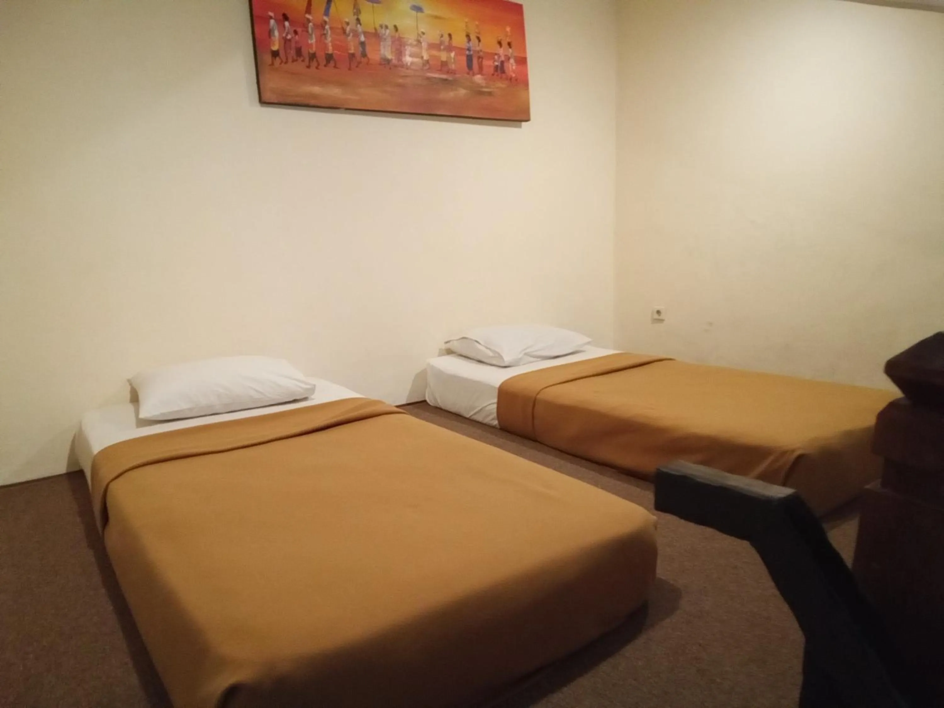 Bed in Hotel Puri Dibia Kuta