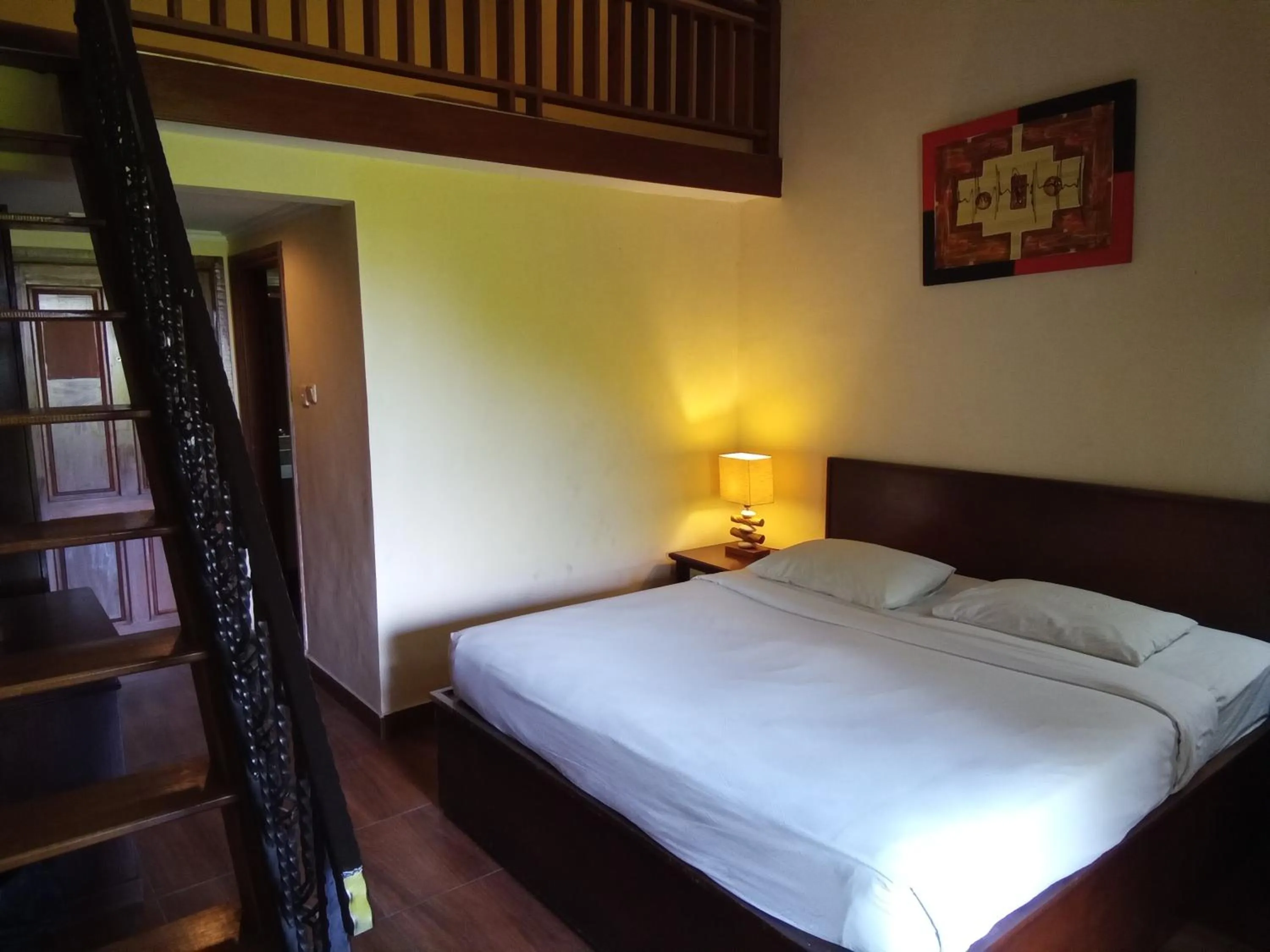 Bed in Hotel Puri Dibia Kuta