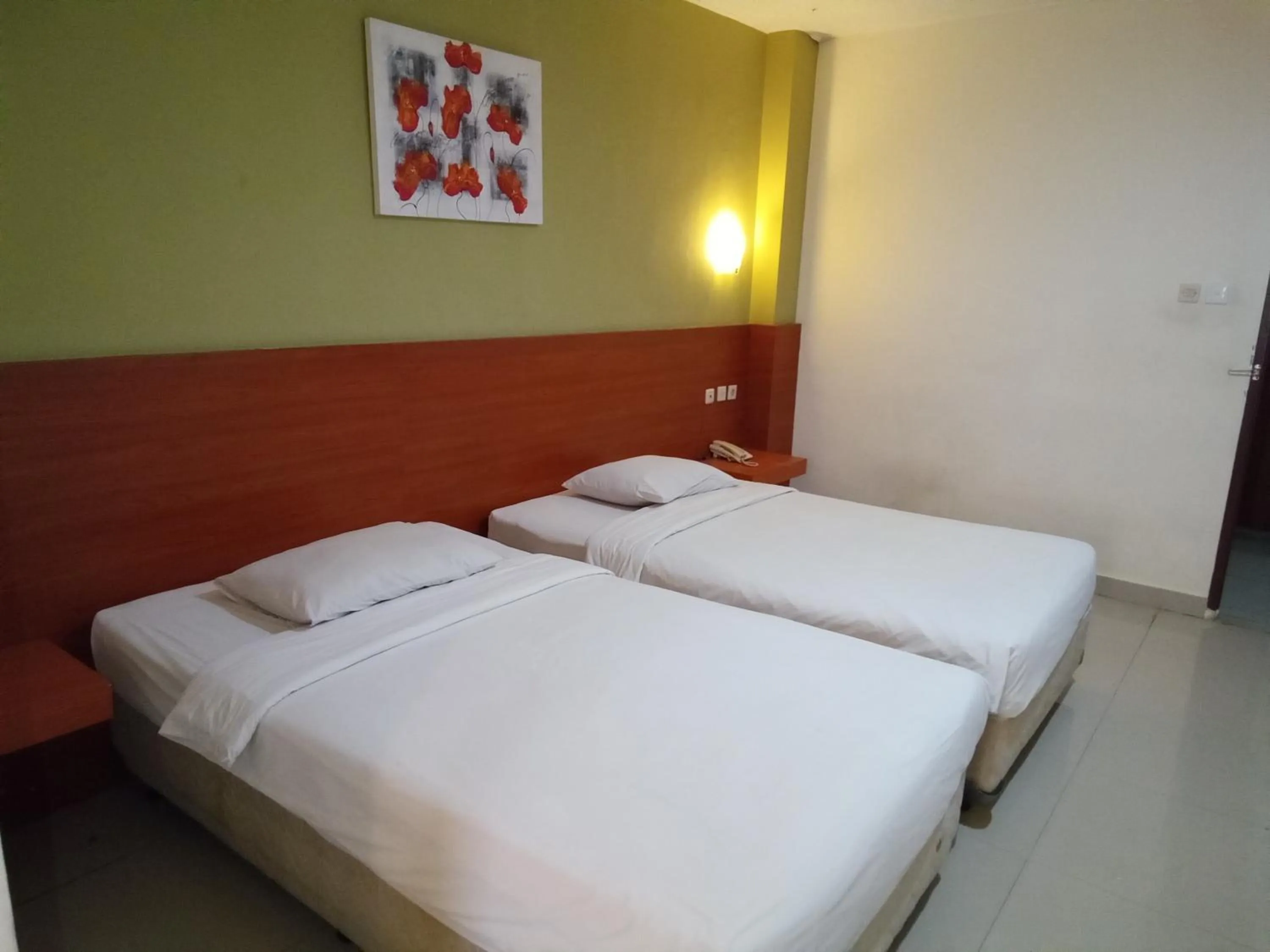 Bed in Hotel Puri Dibia Kuta