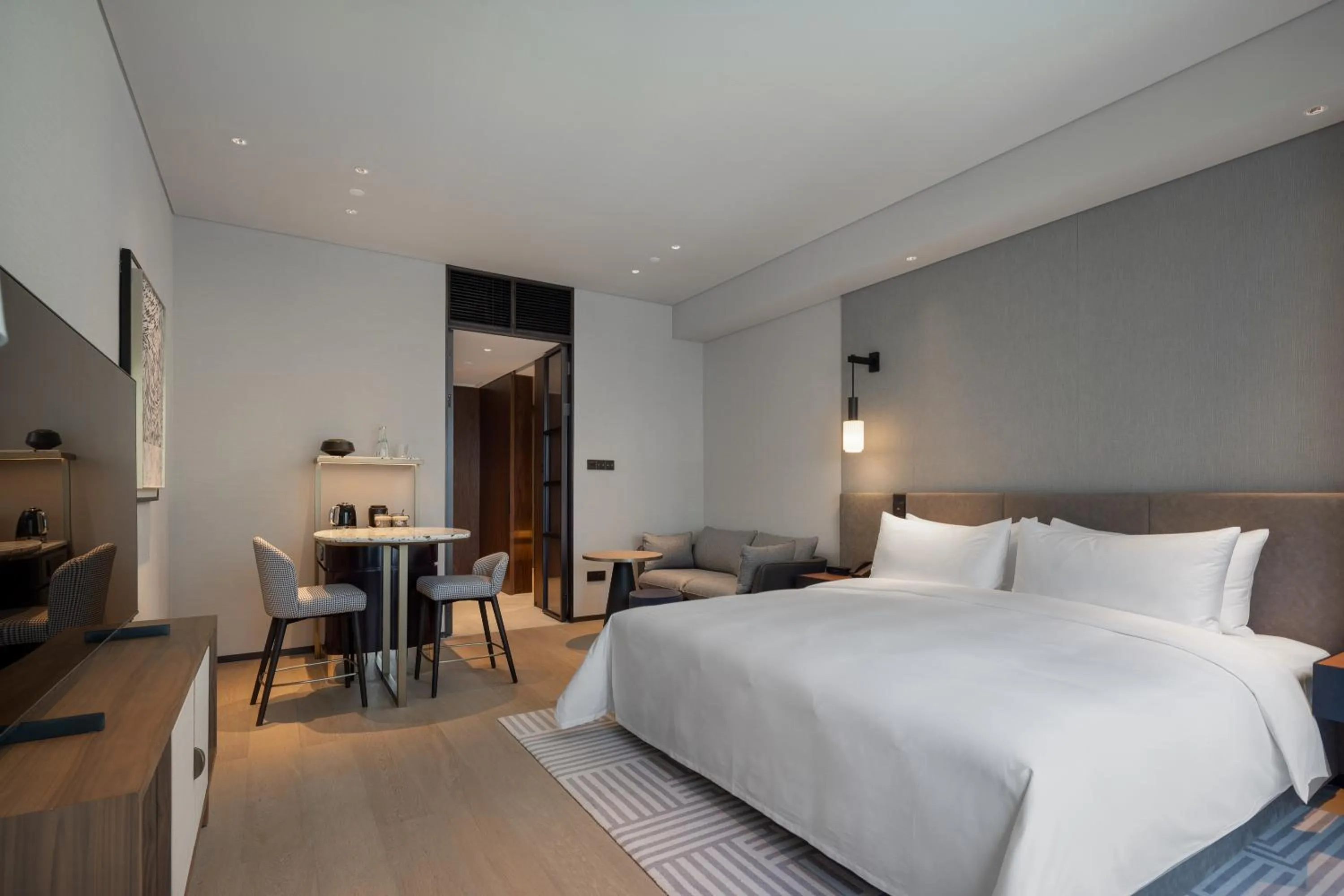 Bed in New World Guangzhou Hotel