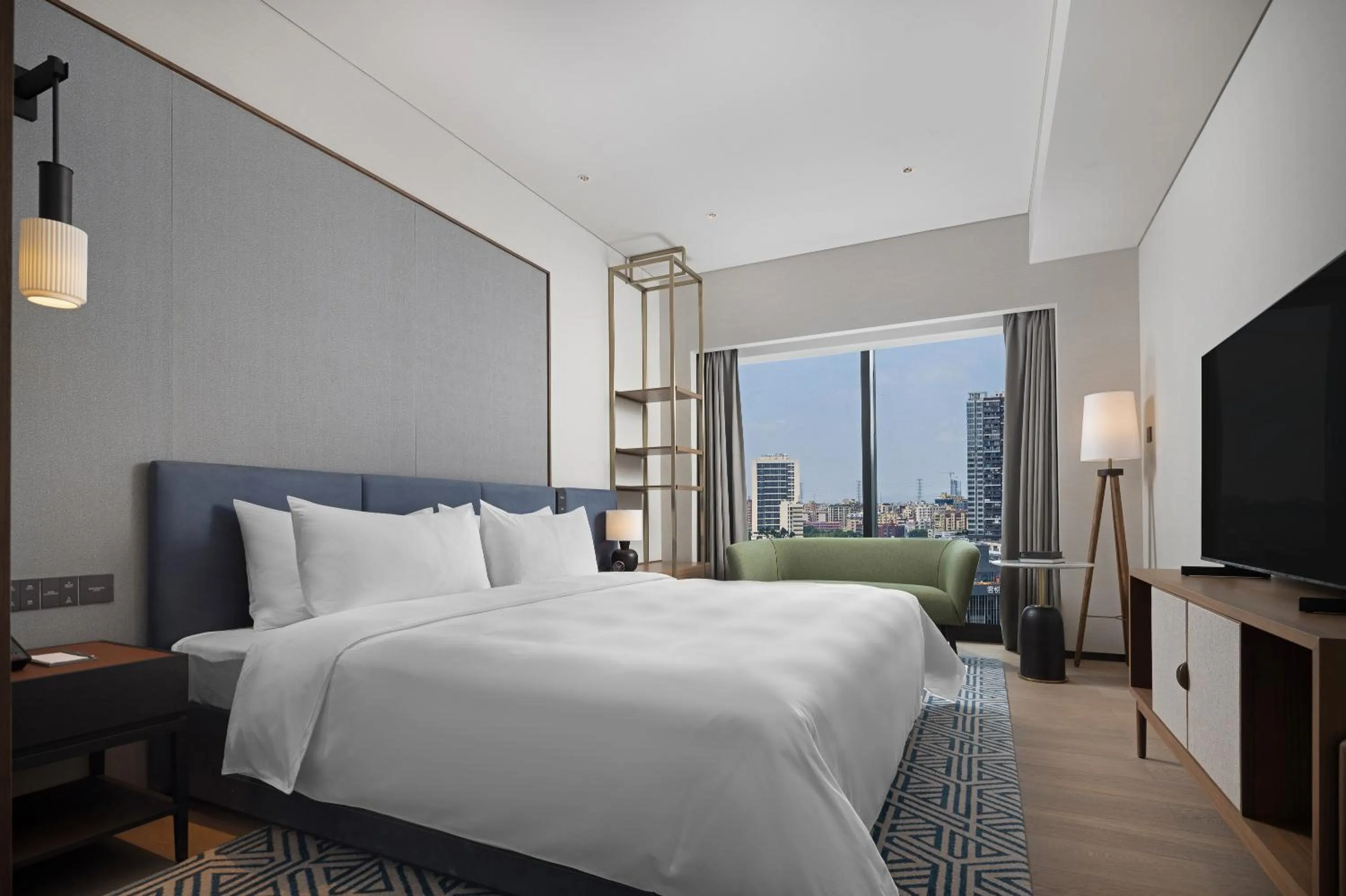 Bed in New World Guangzhou Hotel