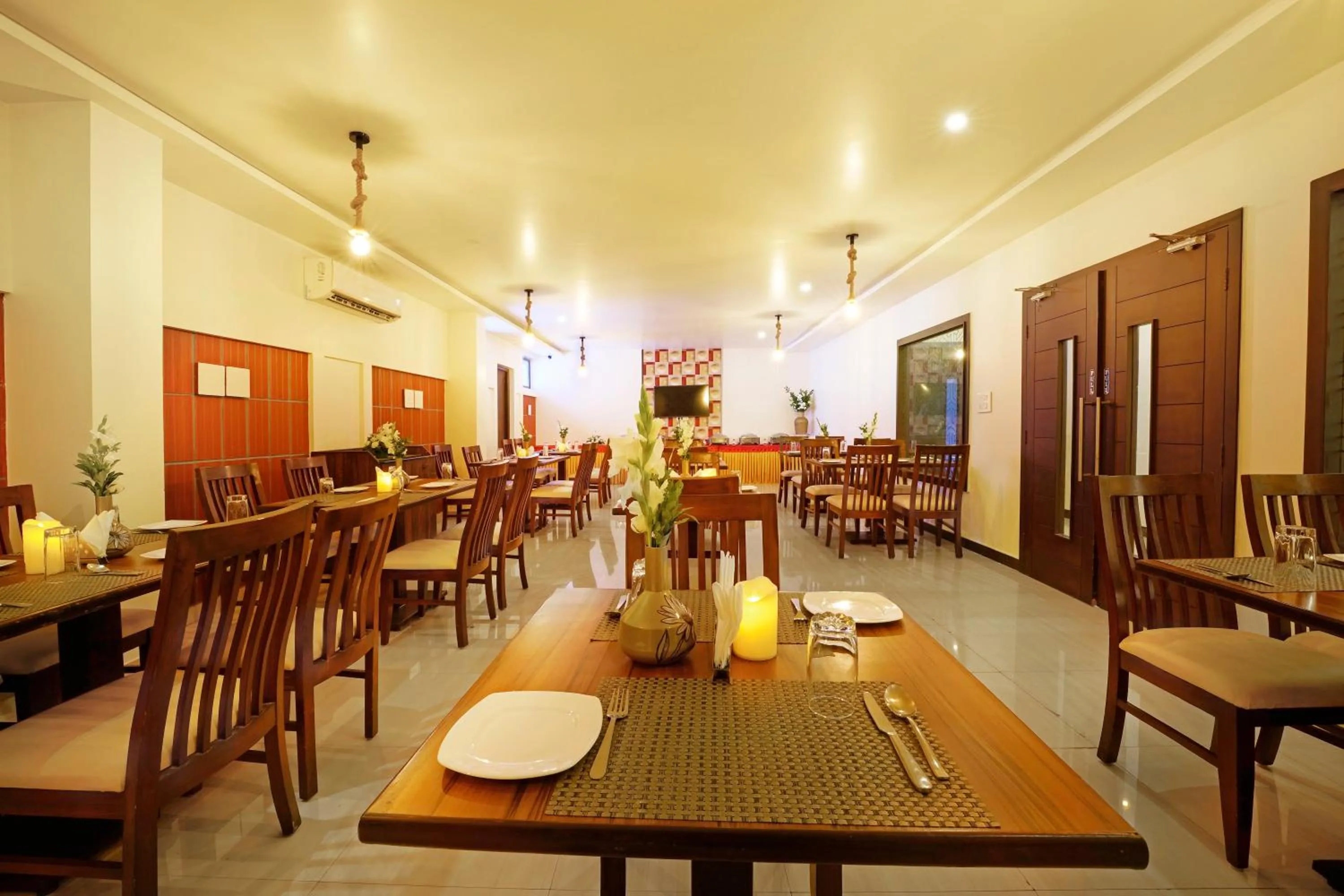 Dining area in Clover - A Rivido Hotel Jigani