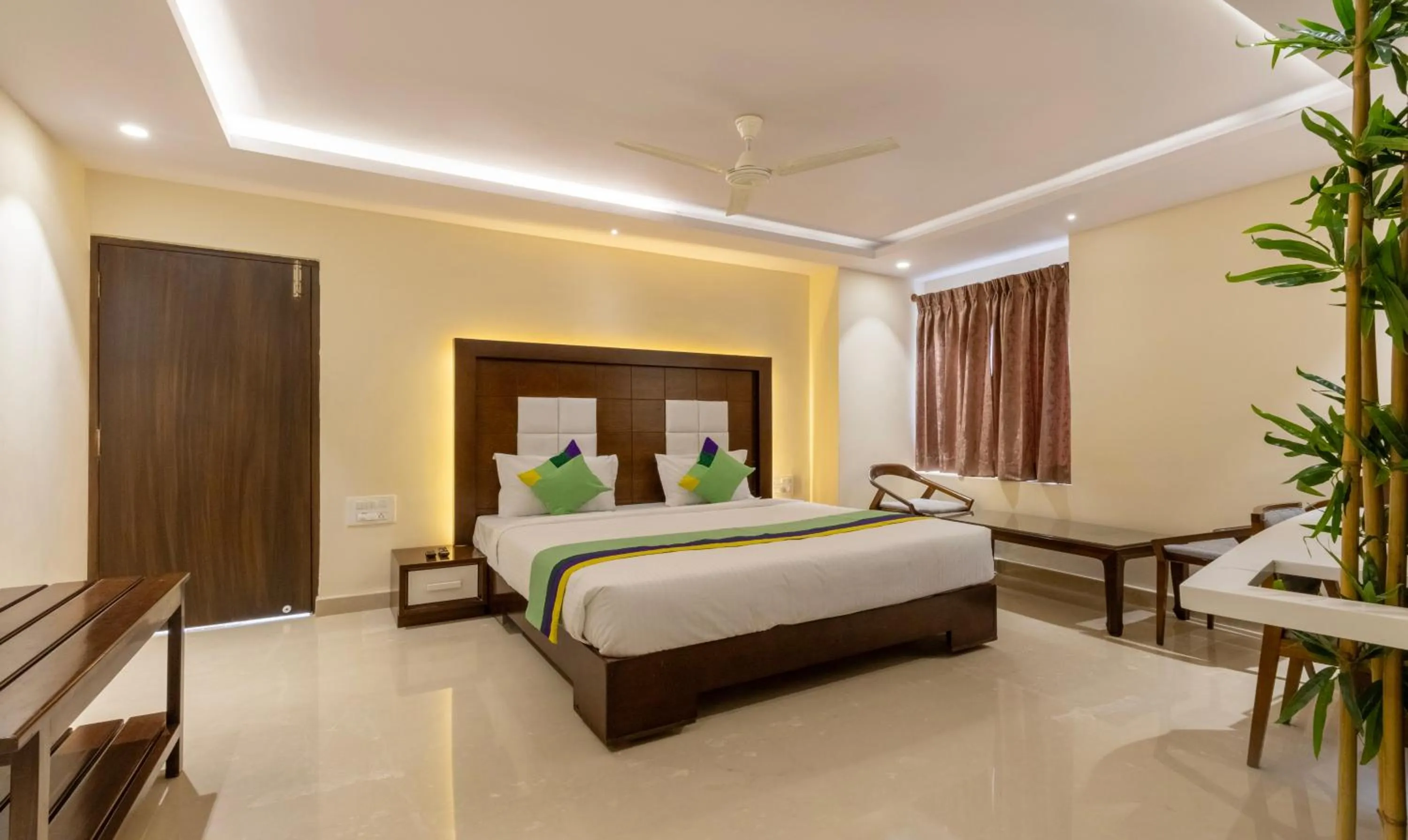 Bedroom, Bed in Treebo Suvarna Comforts