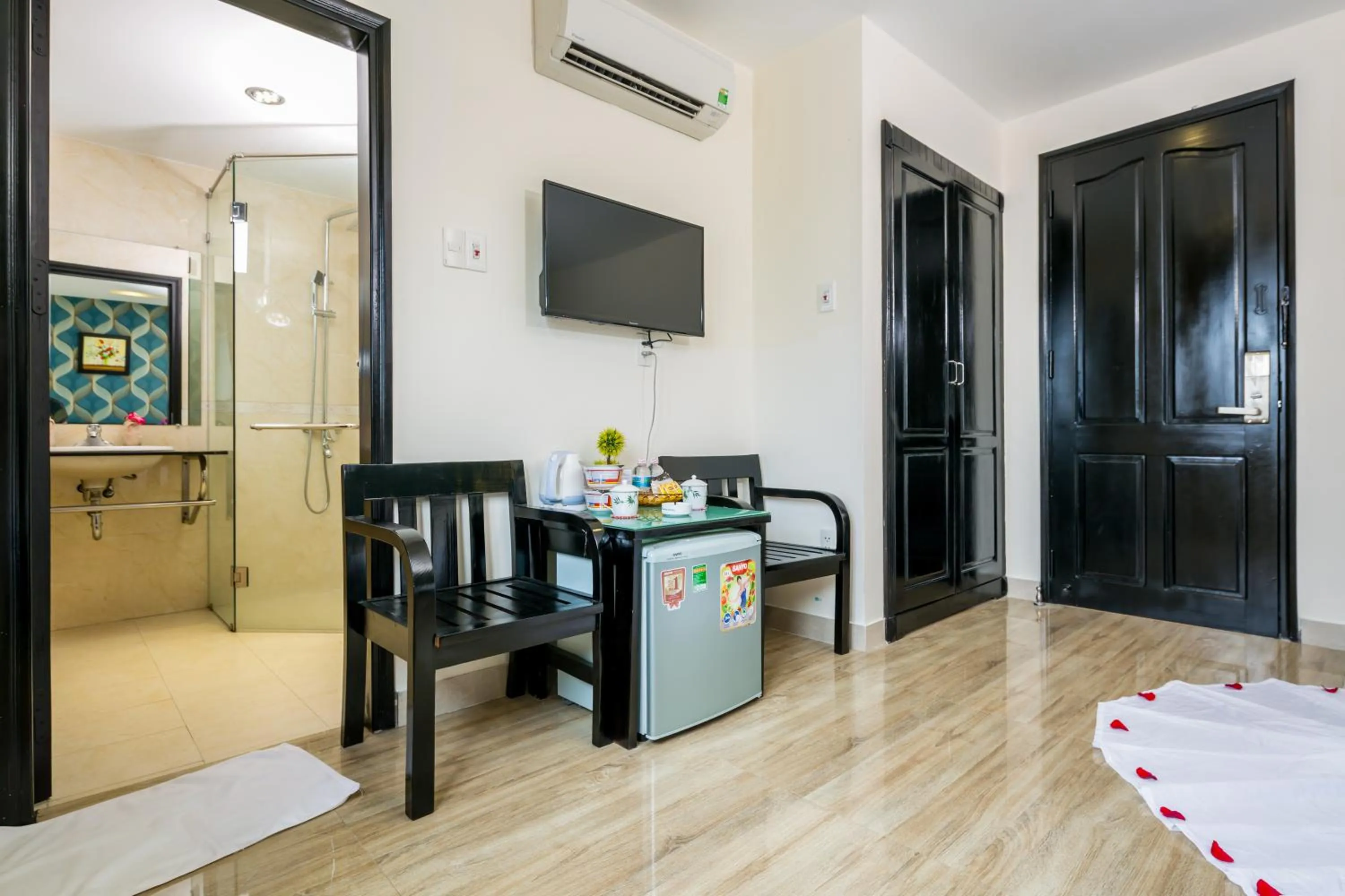 Living room, Bed in La Maison Danang Beach Hotel