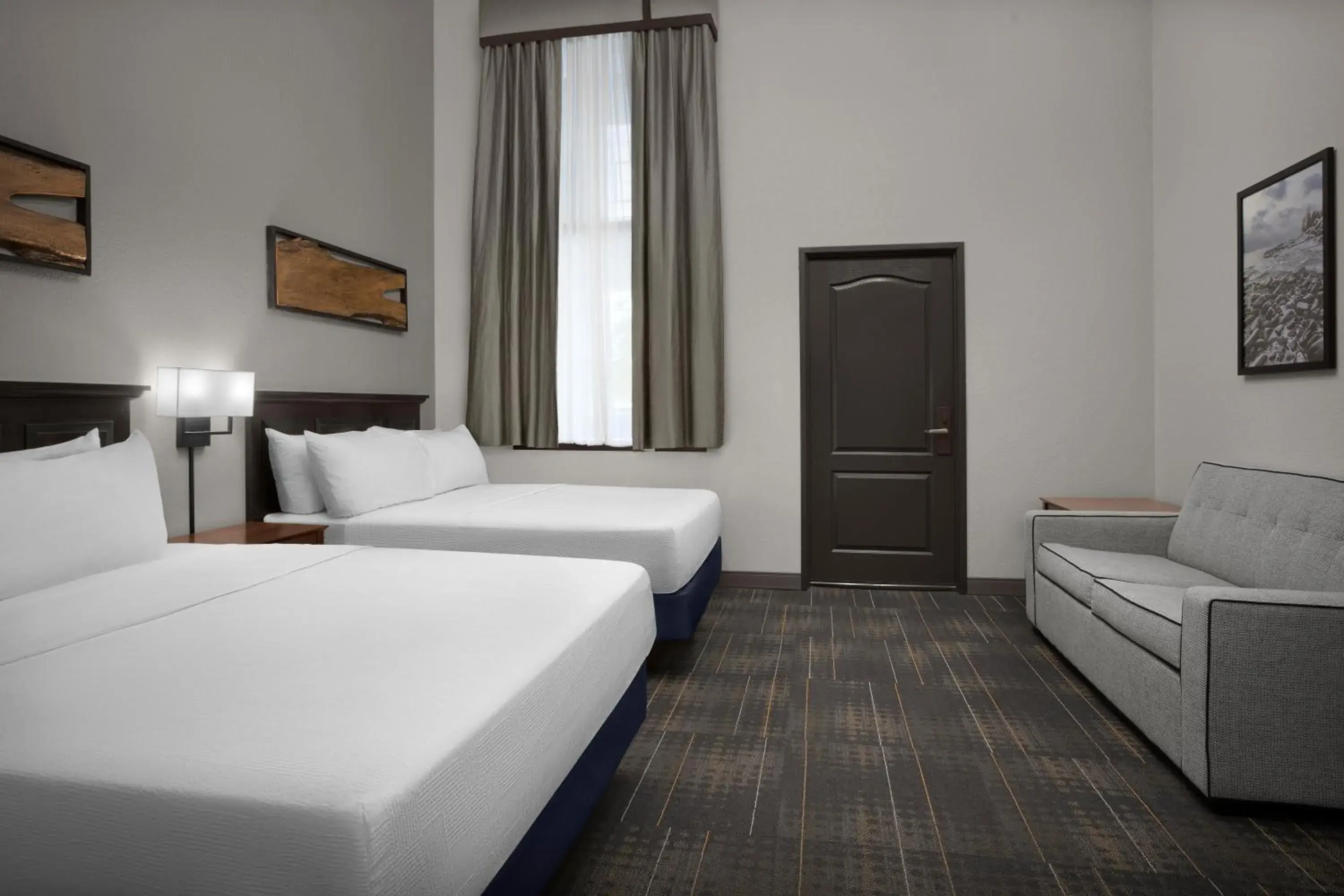 Seating area, Bed in The Suites Hotel at Waterfront Plaza Seating area, Bed in The Suites Hotel at Waterfront Plaza