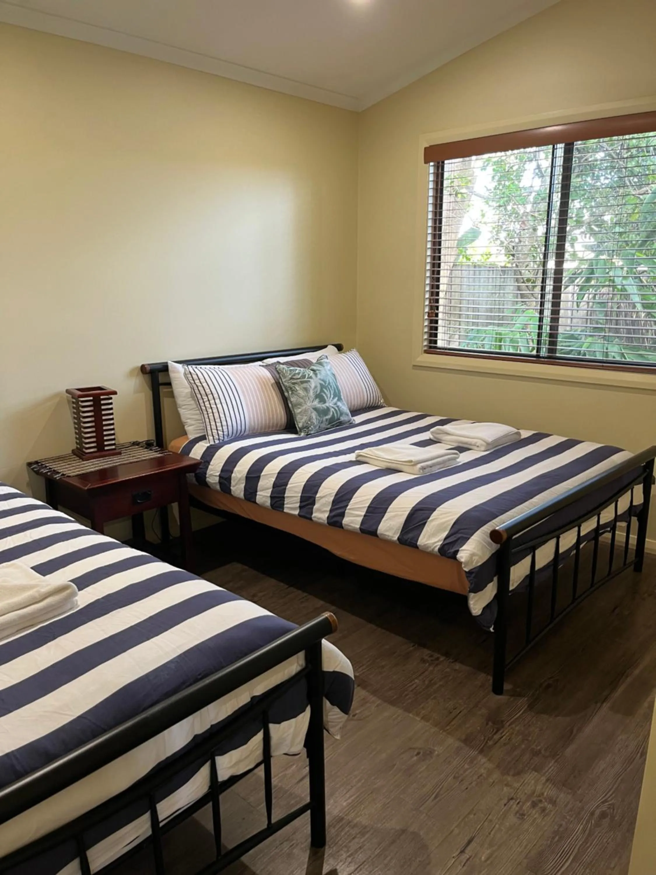 Bed in Safety Beach Bungalows