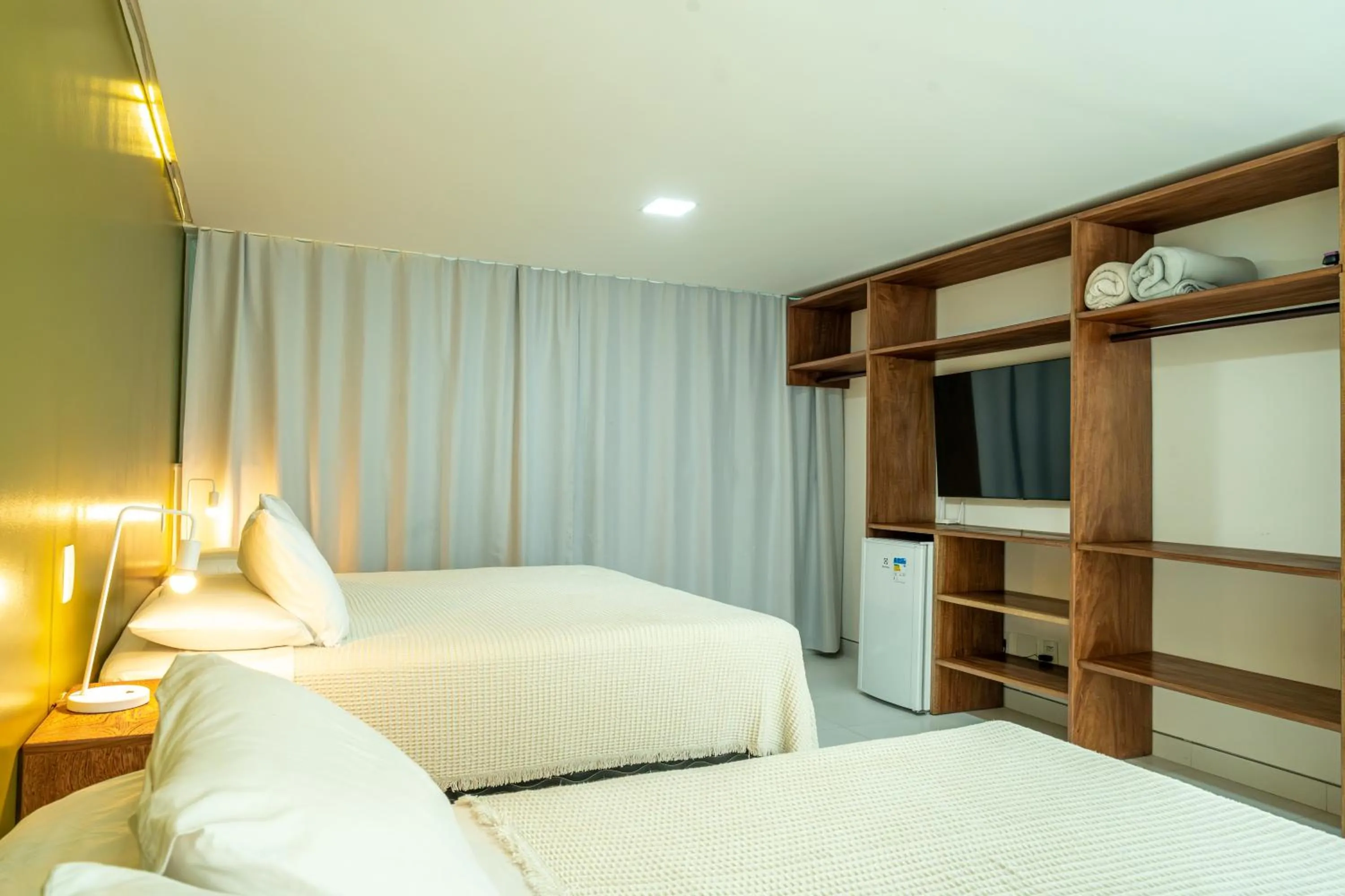 Communal lounge/ TV room, Bed in Pousada Corais de Ibiza