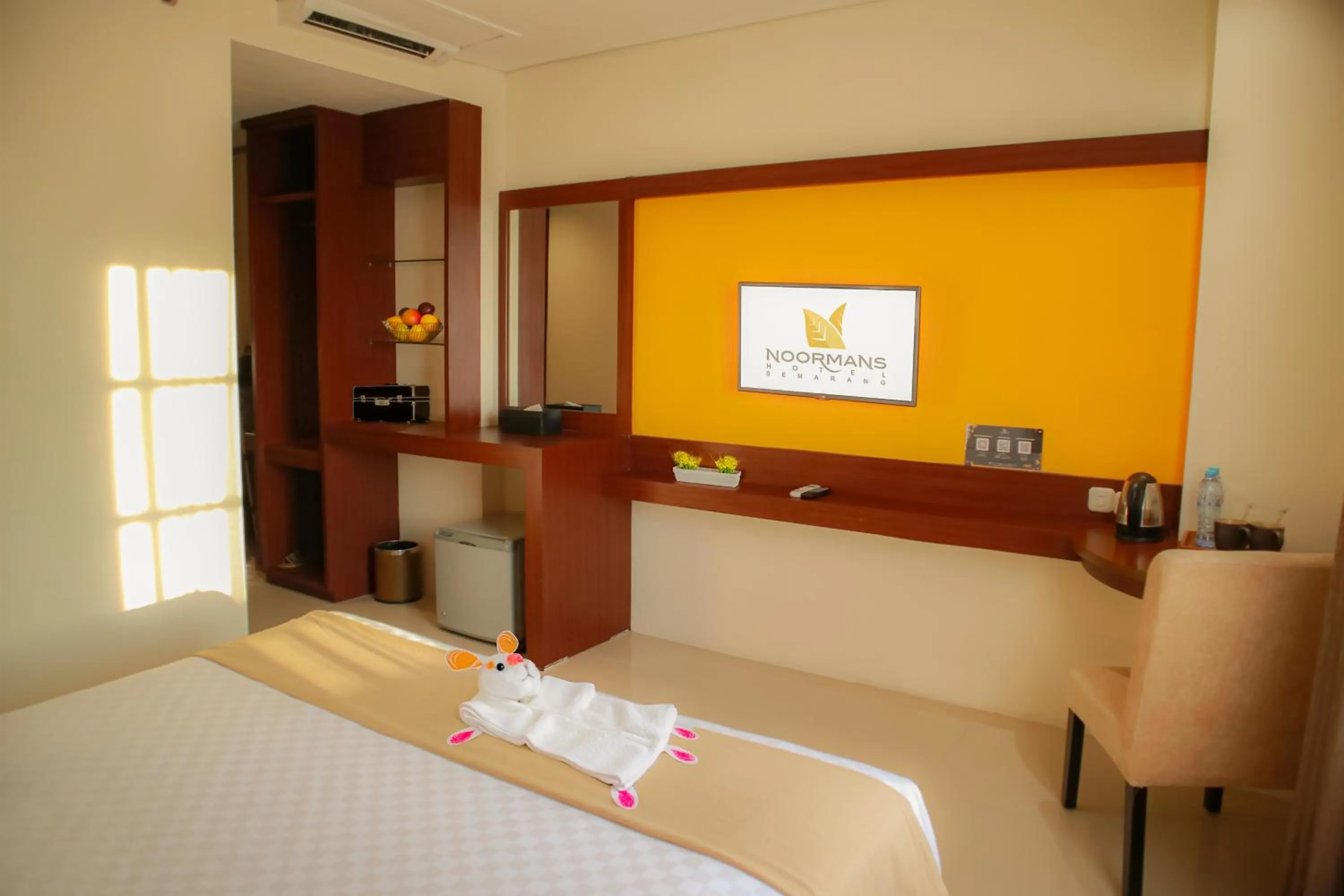 Bed in Noormans Hotel Semarang